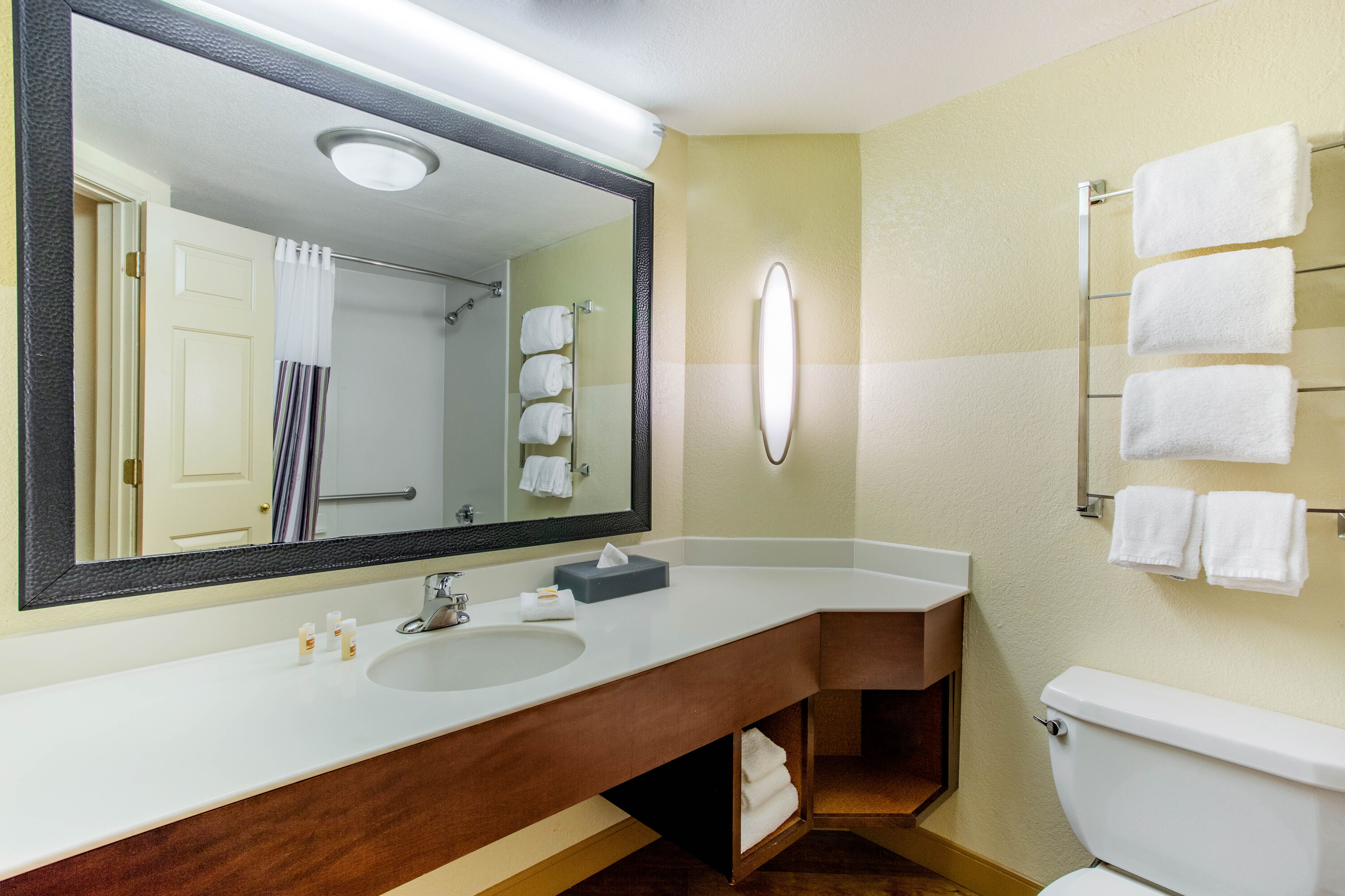 Guest room bath at the La Quinta Inn & Suites by Wyndham Raleigh Crabtree in Raleigh, North Carolina