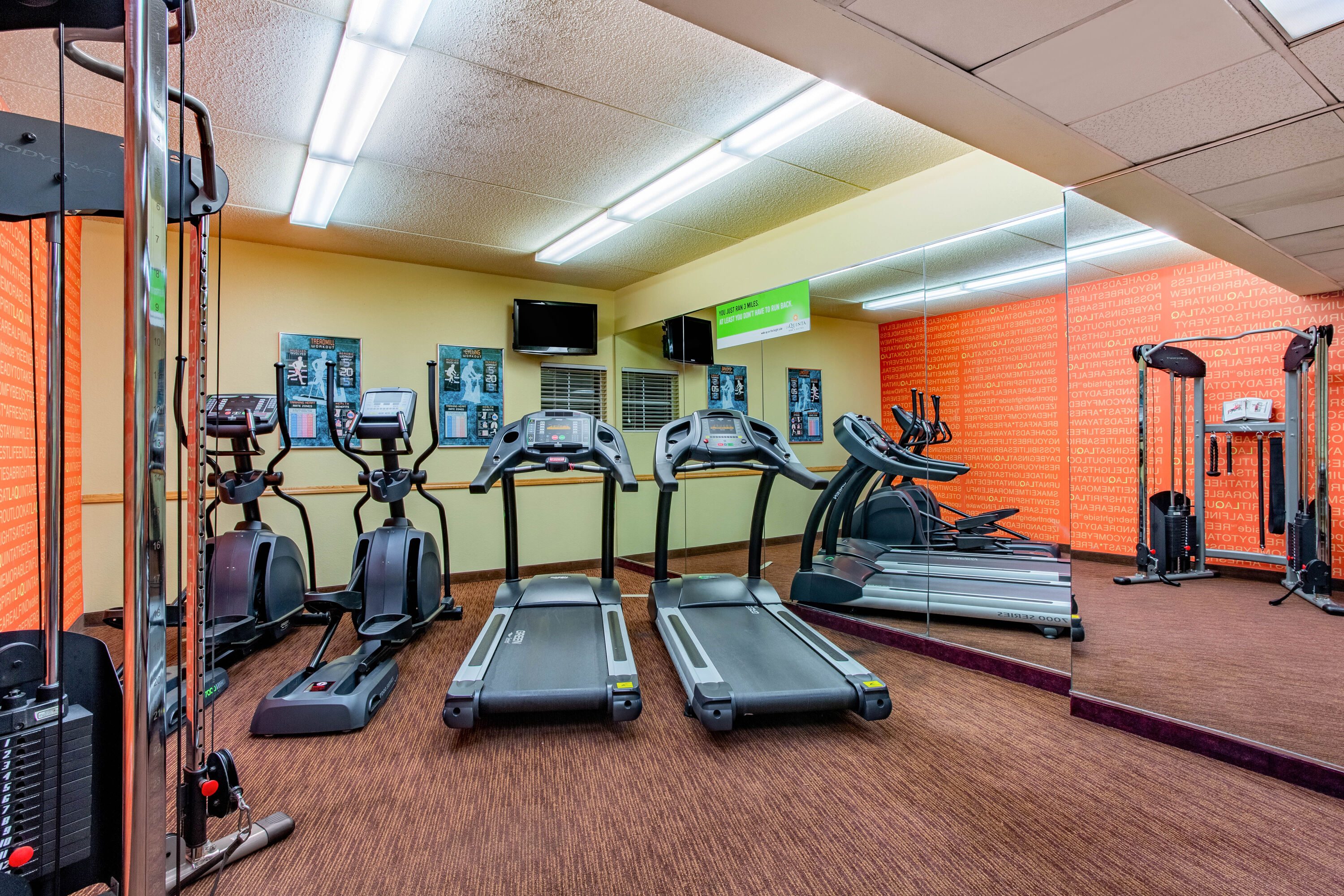 Fitness room at La Quinta Inn & Suites by Wyndham Raleigh Crabtree in Raleigh, North Carolina