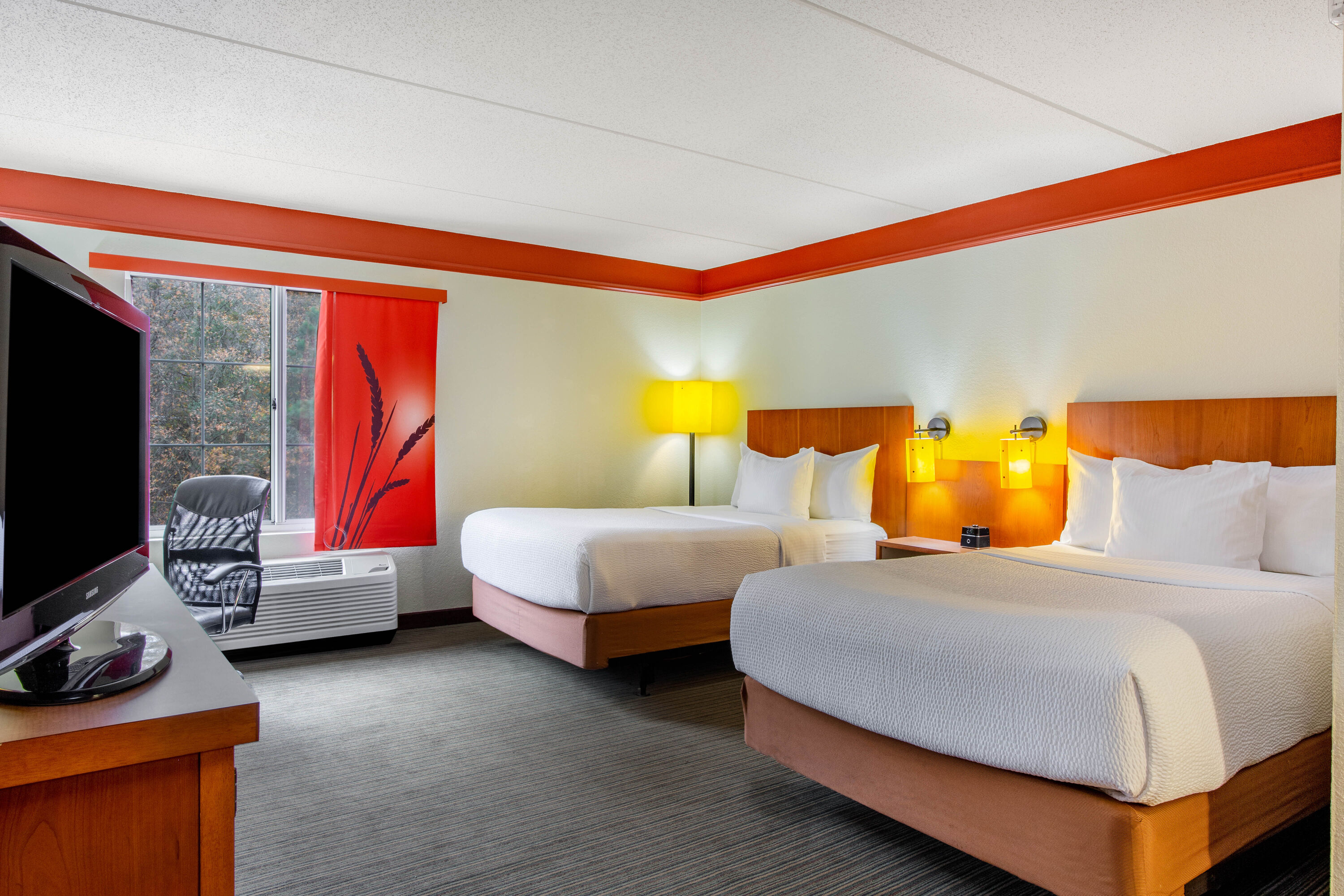 Guest room at the La Quinta Inn & Suites by Wyndham Raleigh Crabtree in Raleigh, North Carolina