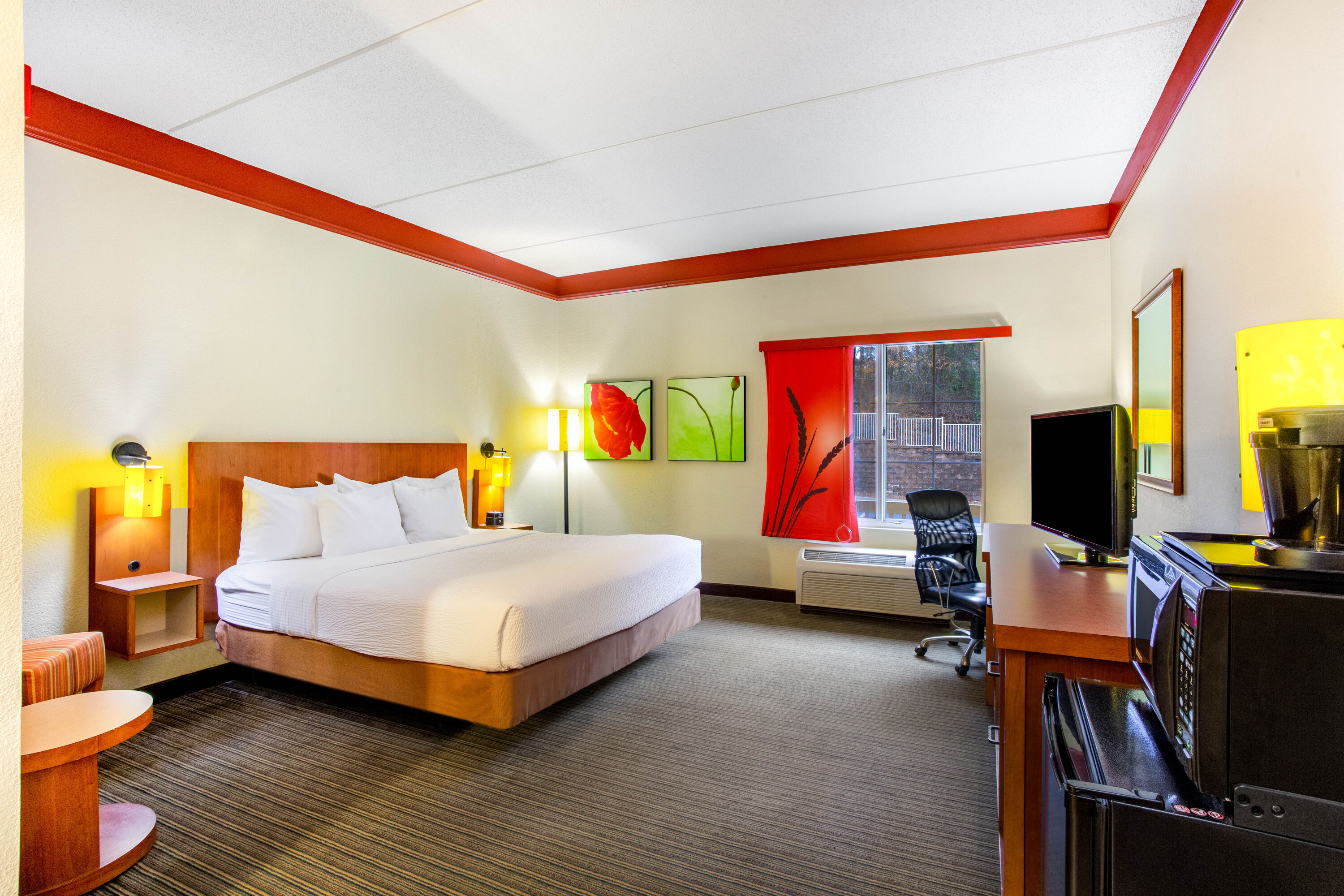 Guest room at the La Quinta Inn & Suites by Wyndham Raleigh Crabtree in Raleigh, North Carolina