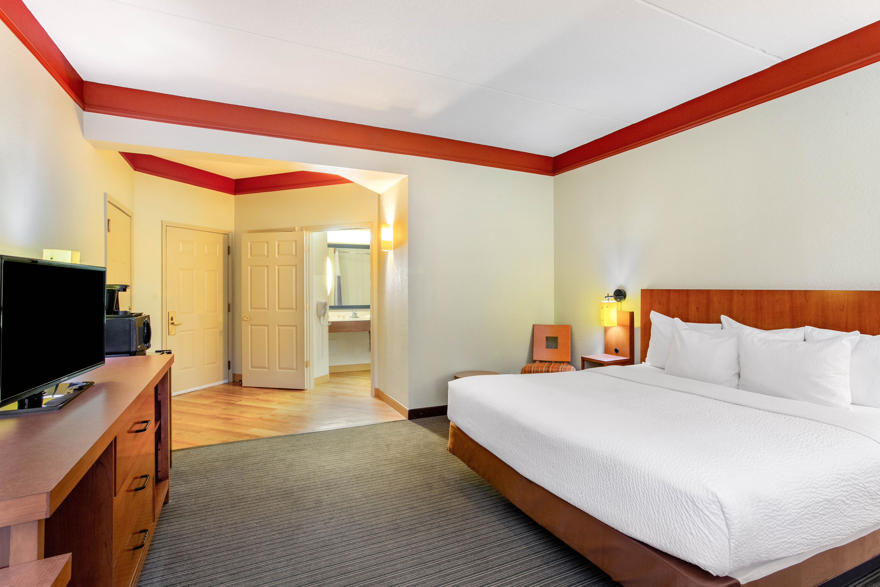 Guest room at the La Quinta Inn & Suites by Wyndham Raleigh Crabtree in Raleigh, North Carolina