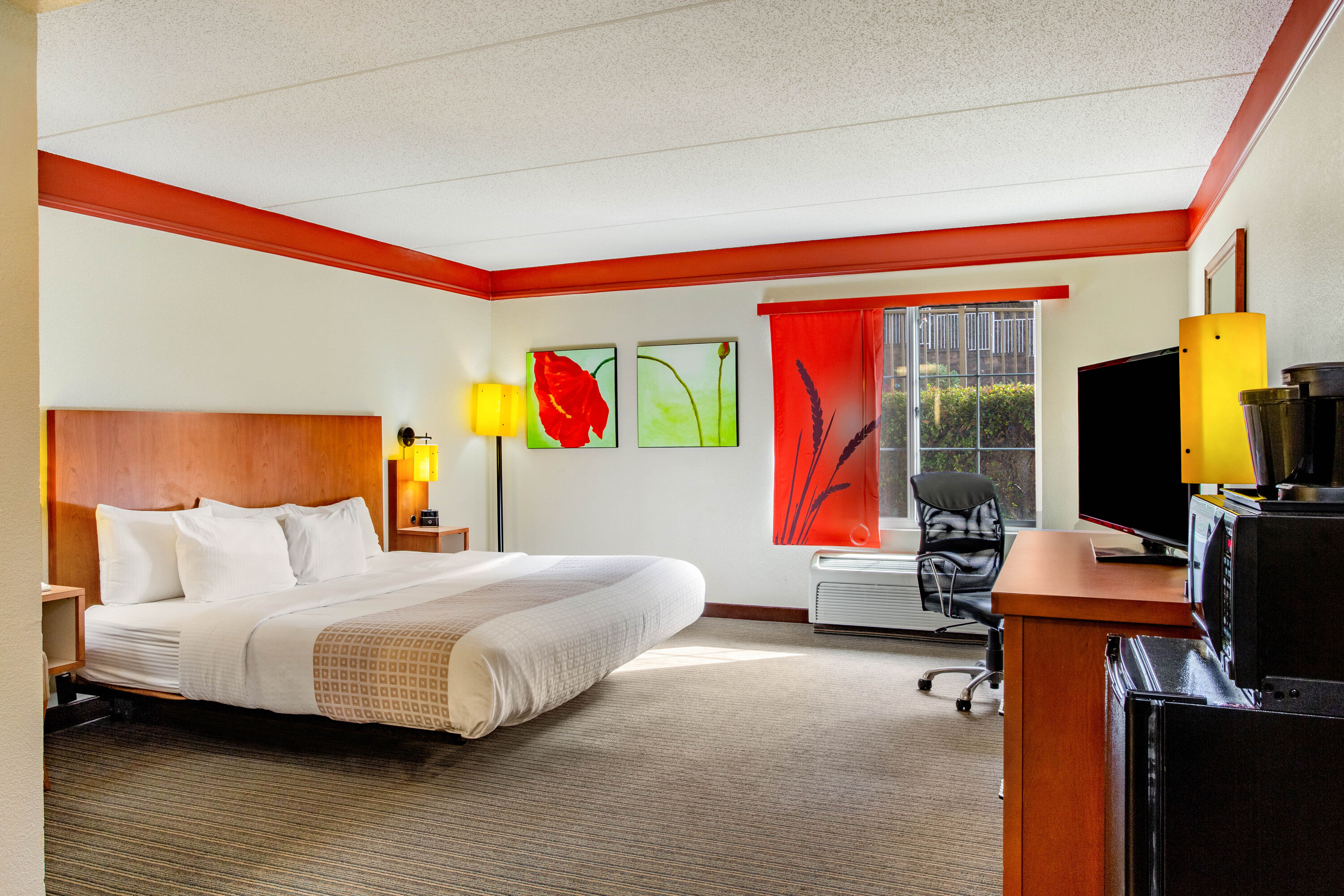 Guest room at the La Quinta Inn & Suites by Wyndham Raleigh Crabtree in Raleigh, North Carolina