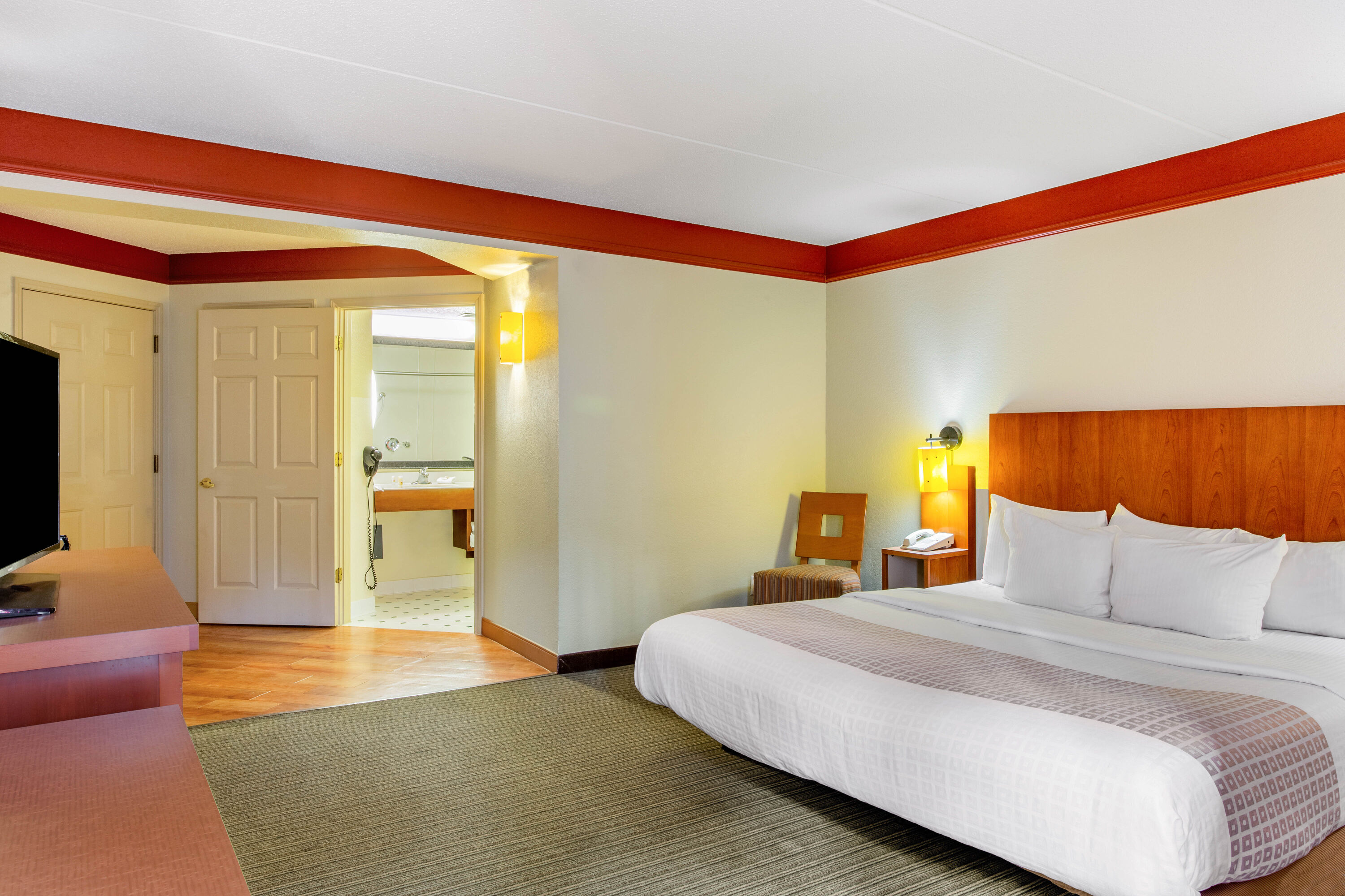 Guest room at the La Quinta Inn & Suites by Wyndham Raleigh Crabtree in Raleigh, North Carolina