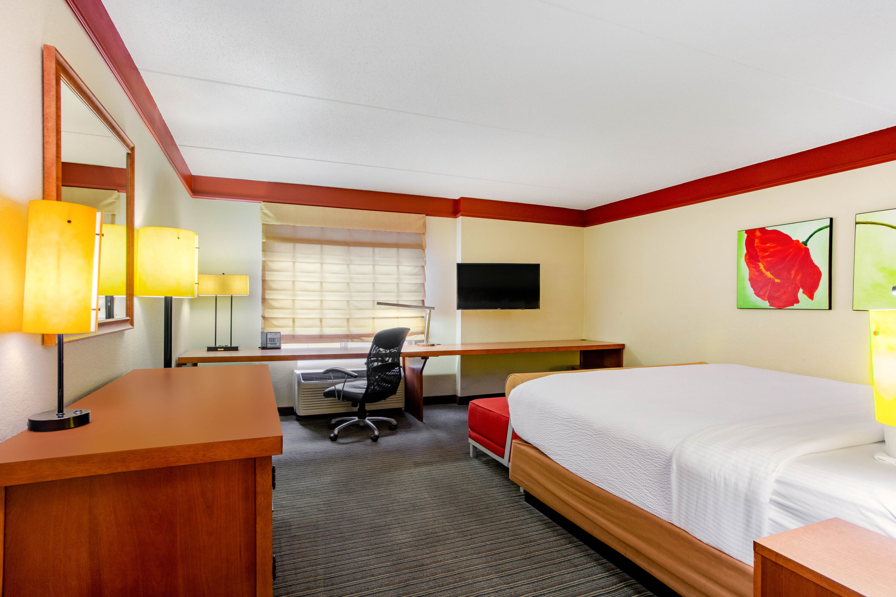 Guest room at the La Quinta Inn & Suites by Wyndham Raleigh Crabtree in Raleigh, North Carolina