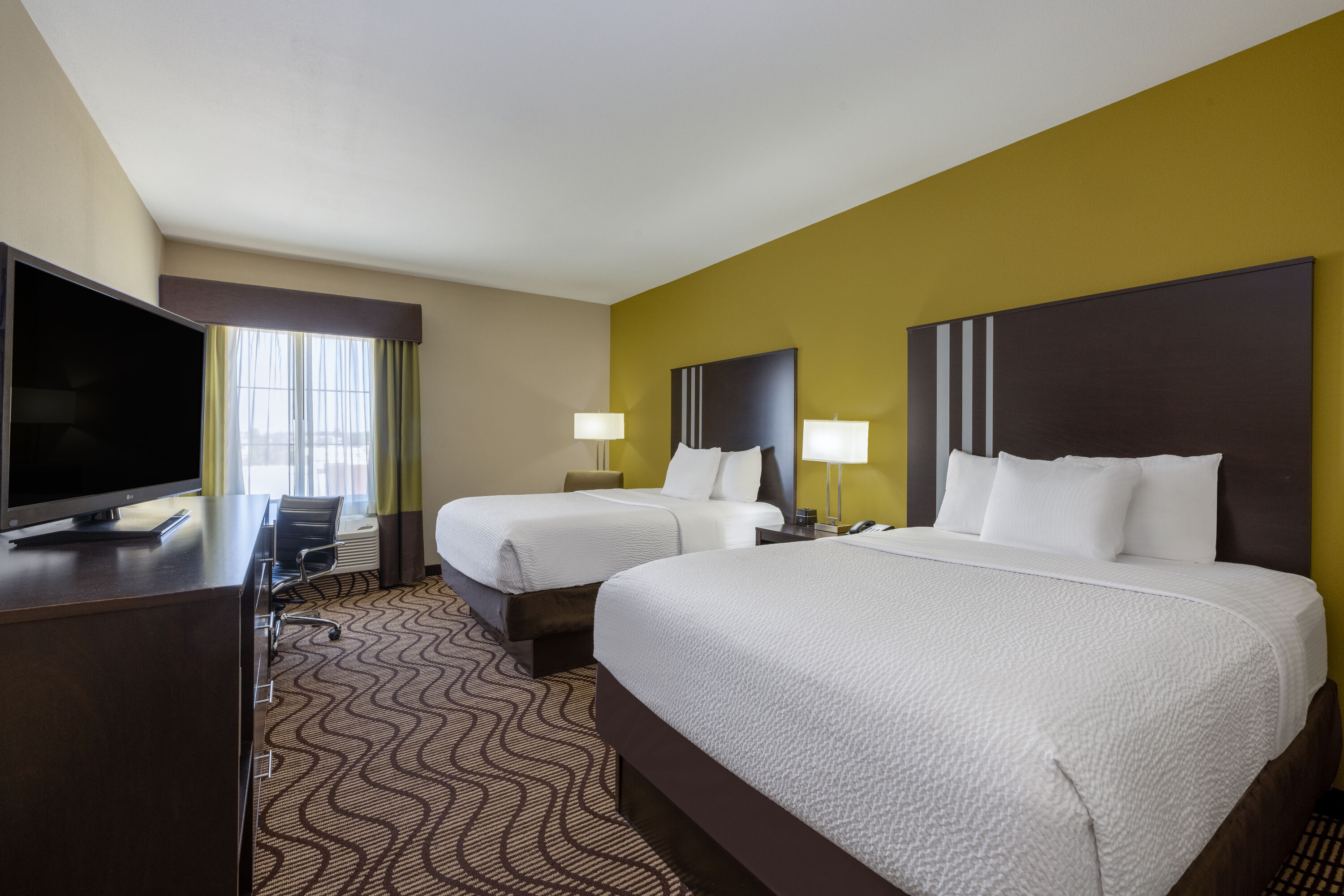 Guest room at the La Quinta Inn & Suites by Wyndham Artesia in Artesia, New Mexico