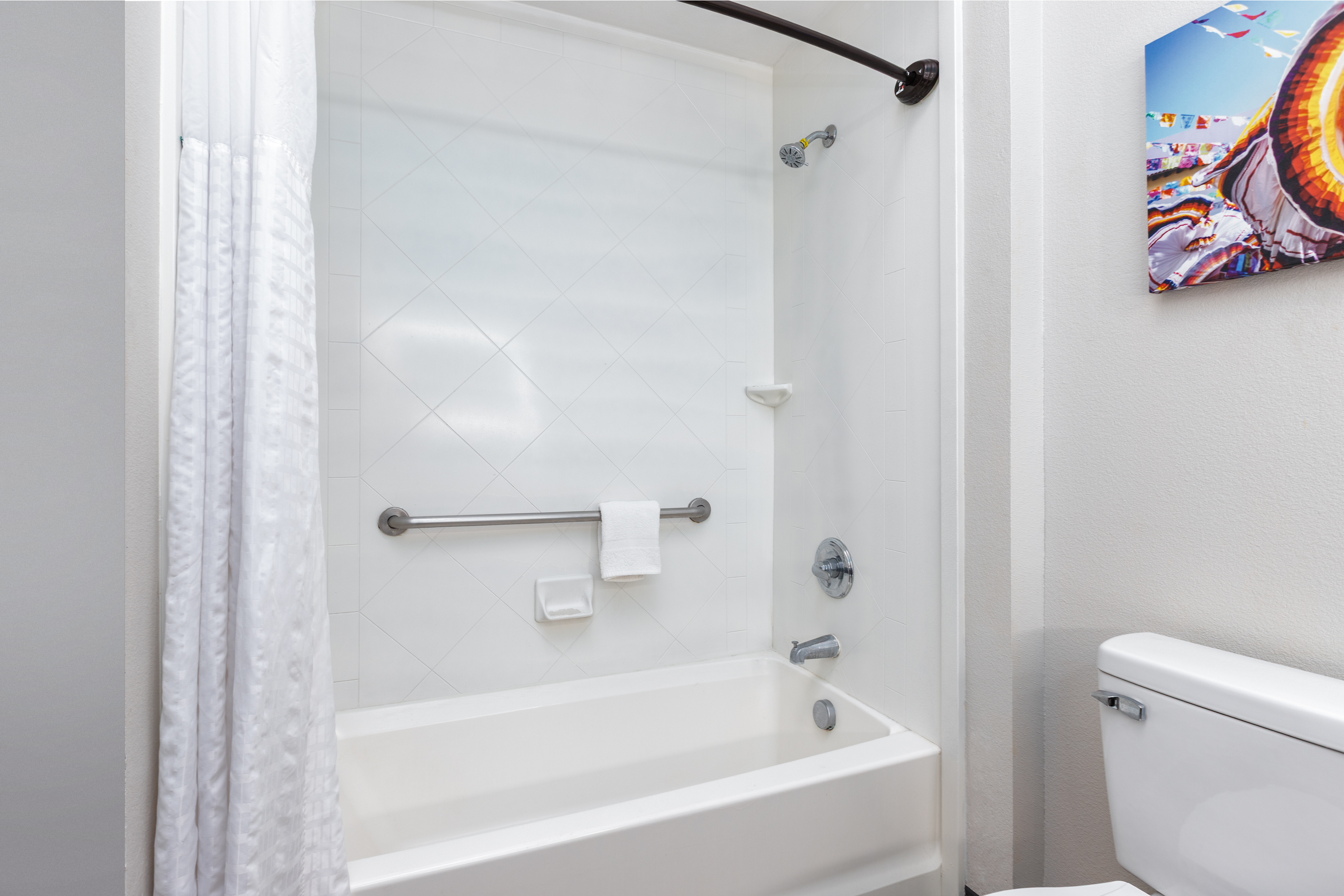 Guest room bath at the La Quinta Inn & Suites by Wyndham Hobbs in Hobbs, New Mexico
