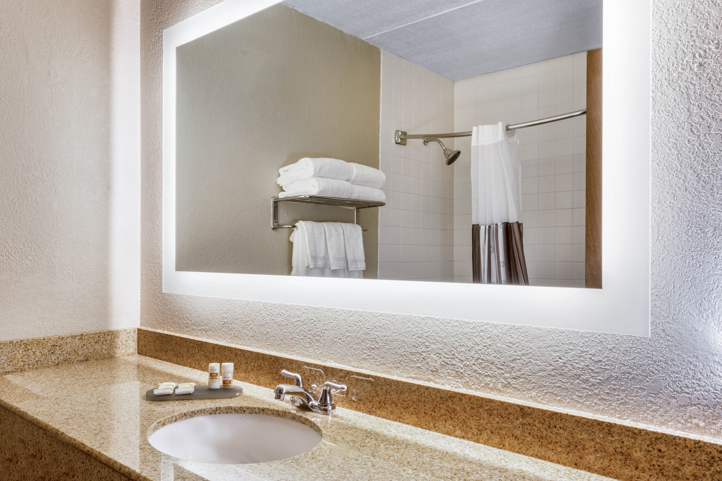 Guest room bath at the La Quinta Inn by Wyndham Binghamton - Johnson City in Johnson City, New York