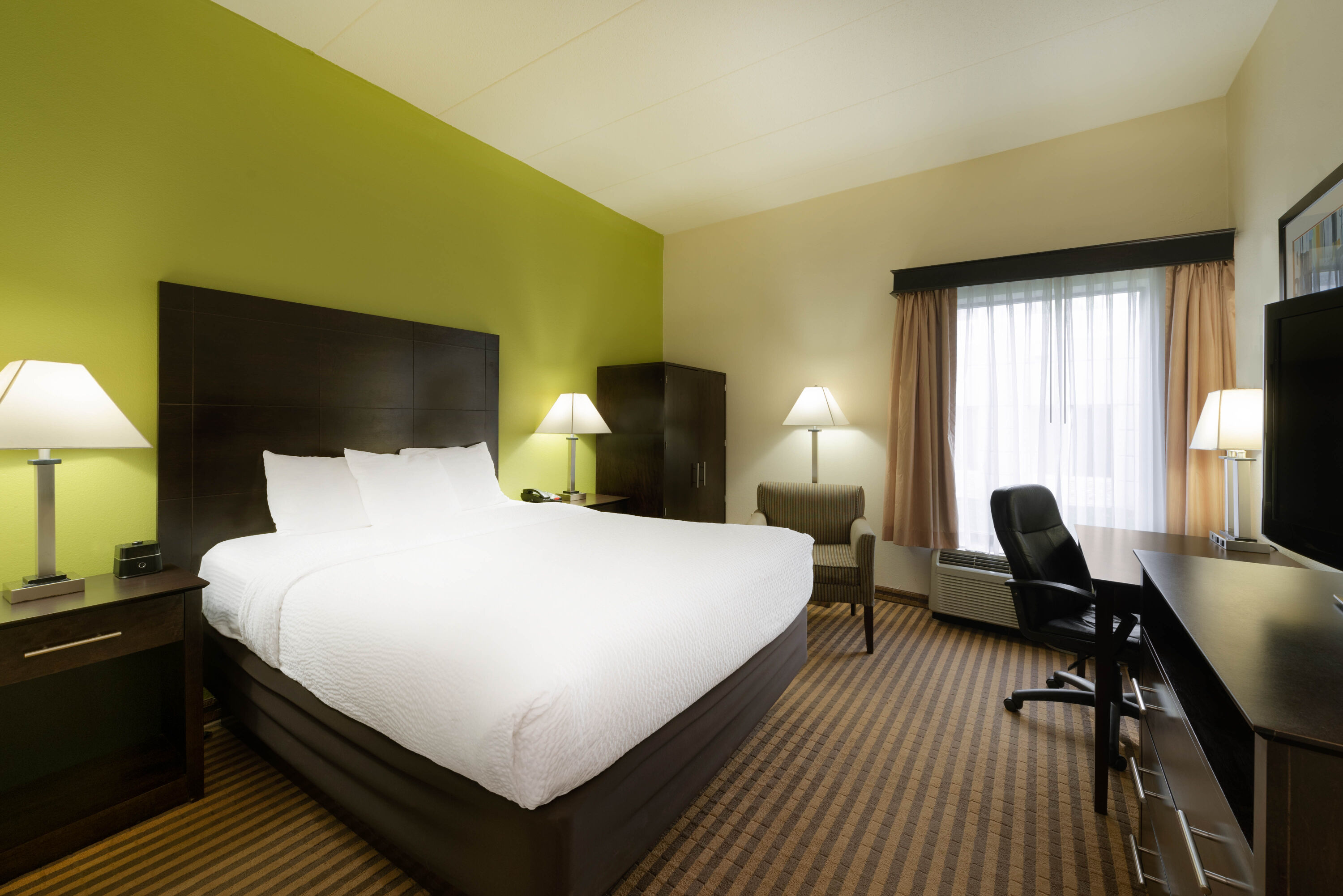 Guest room at the La Quinta Inn & Suites by Wyndham Columbus - Grove City in Grove City, Ohio