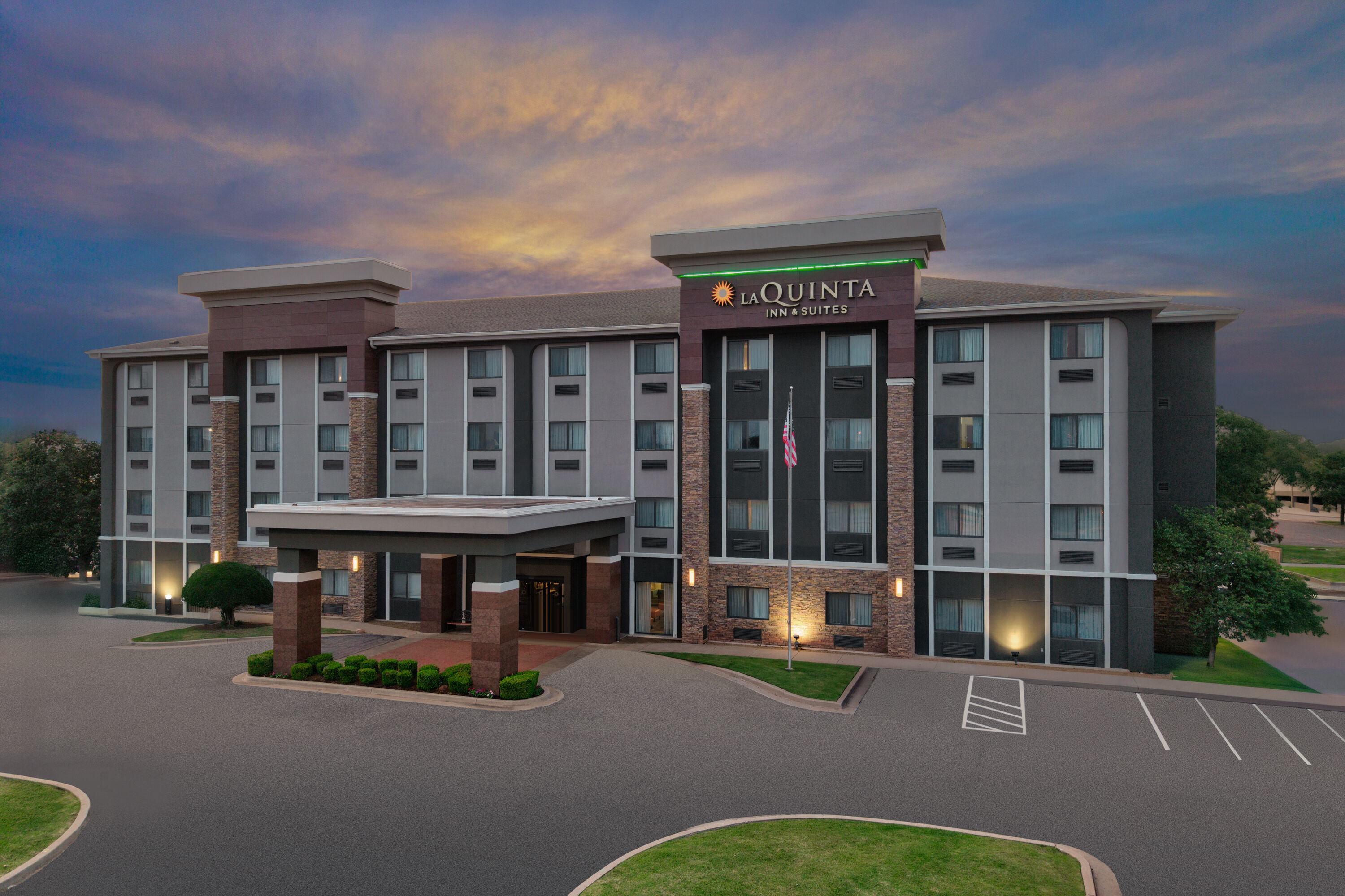 Exterior Dusk Image of La Quinta Inn & Suites by Wyndham Midwest City - Tinker AFB hotel in Midwest City, Oklahoma