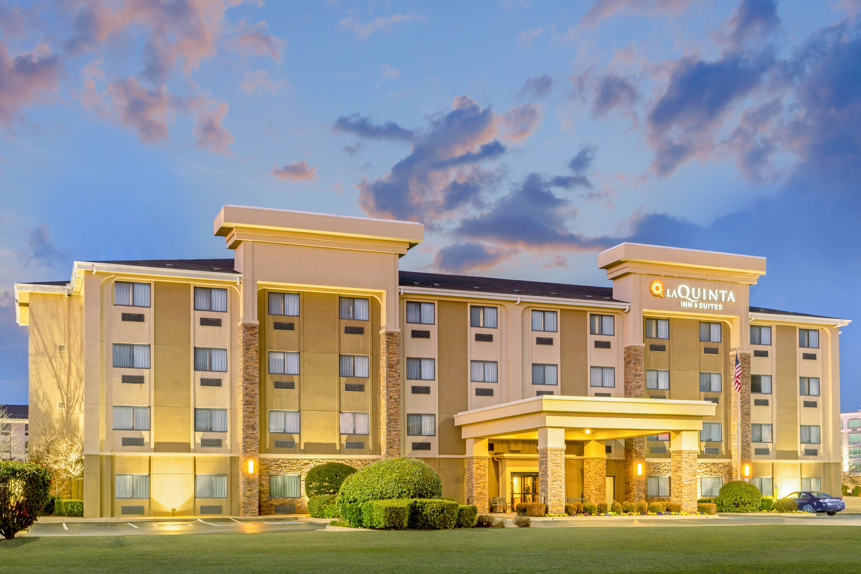 Exterior Dusk Image of La Quinta Inn & Suites by Wyndham Midwest City - Tinker AFB hotel in Midwest City, Oklahoma