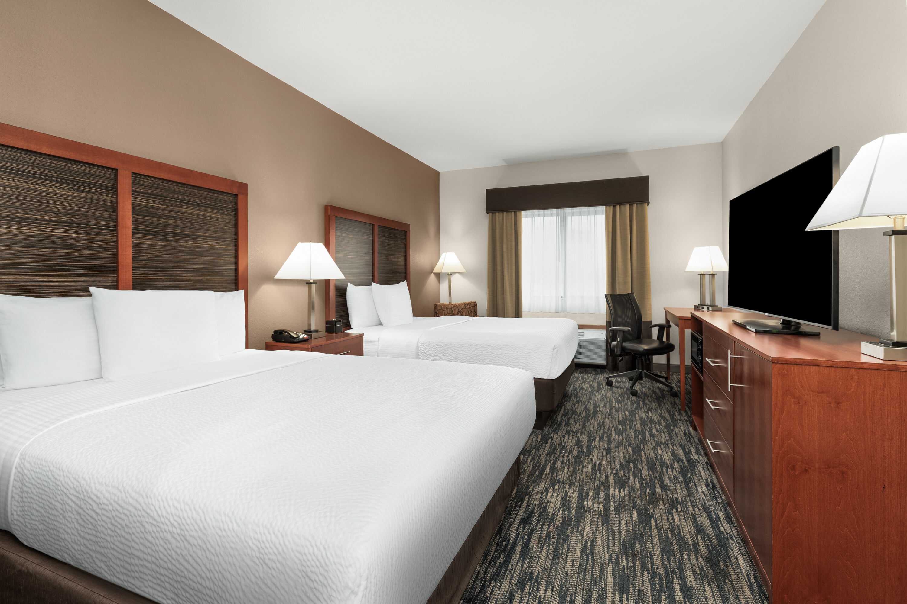Guest room at the La Quinta Inn & Suites by Wyndham Midwest City - Tinker AFB in Midwest City, Oklahoma