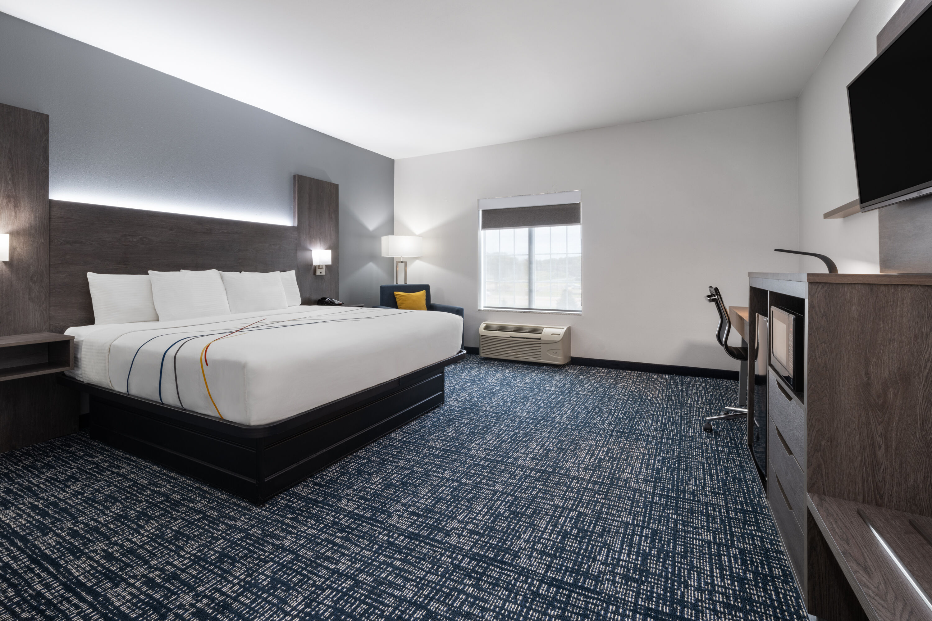 Guest room at the La Quinta Inn & Suites by Wyndham Muskogee in Muskogee, Oklahoma