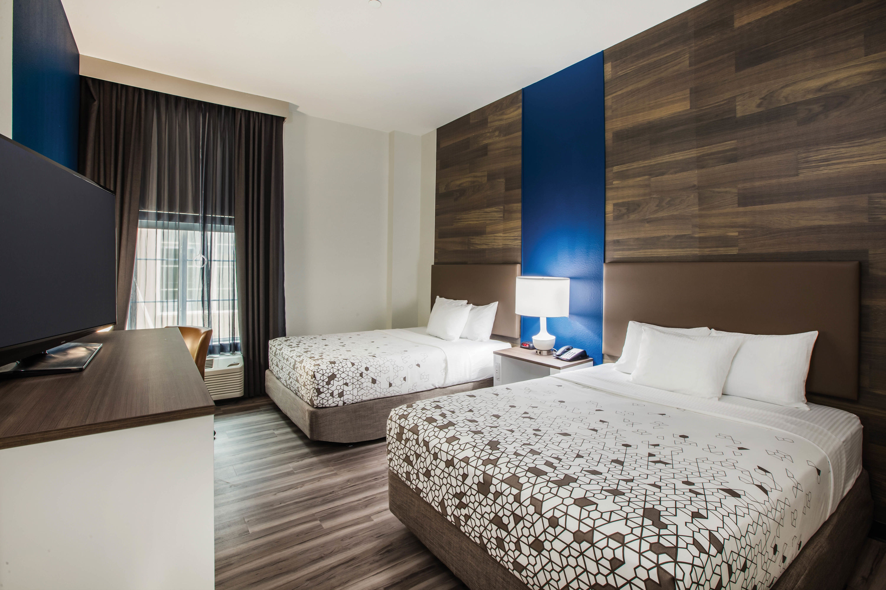 Guest room at the La Quinta Inn & Suites by Wyndham Owasso in Owasso, Oklahoma