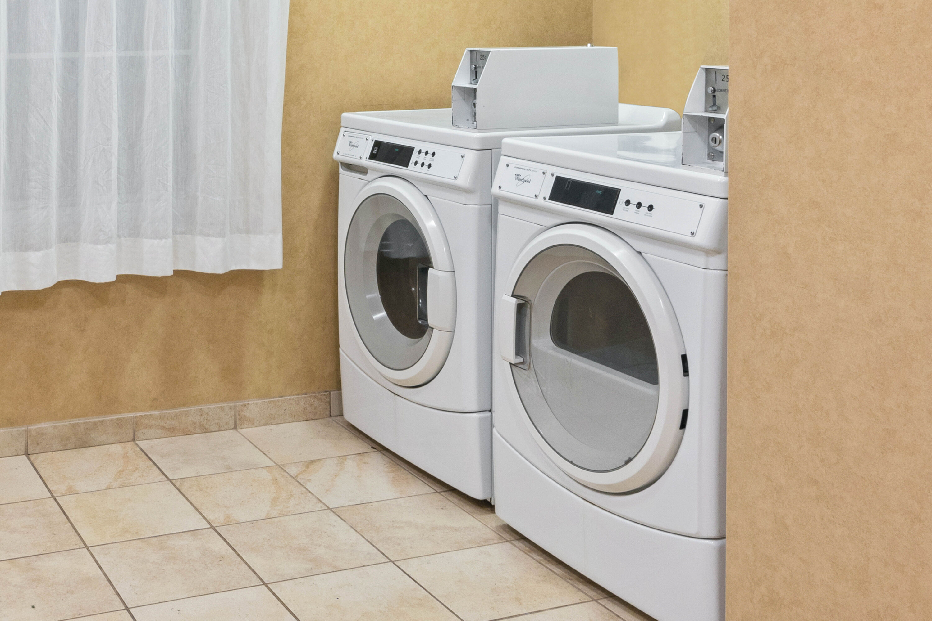 Laundry facilities at La Quinta Inn & Suites by Wyndham Stillwater-University Area in Stillwater, Oklahoma