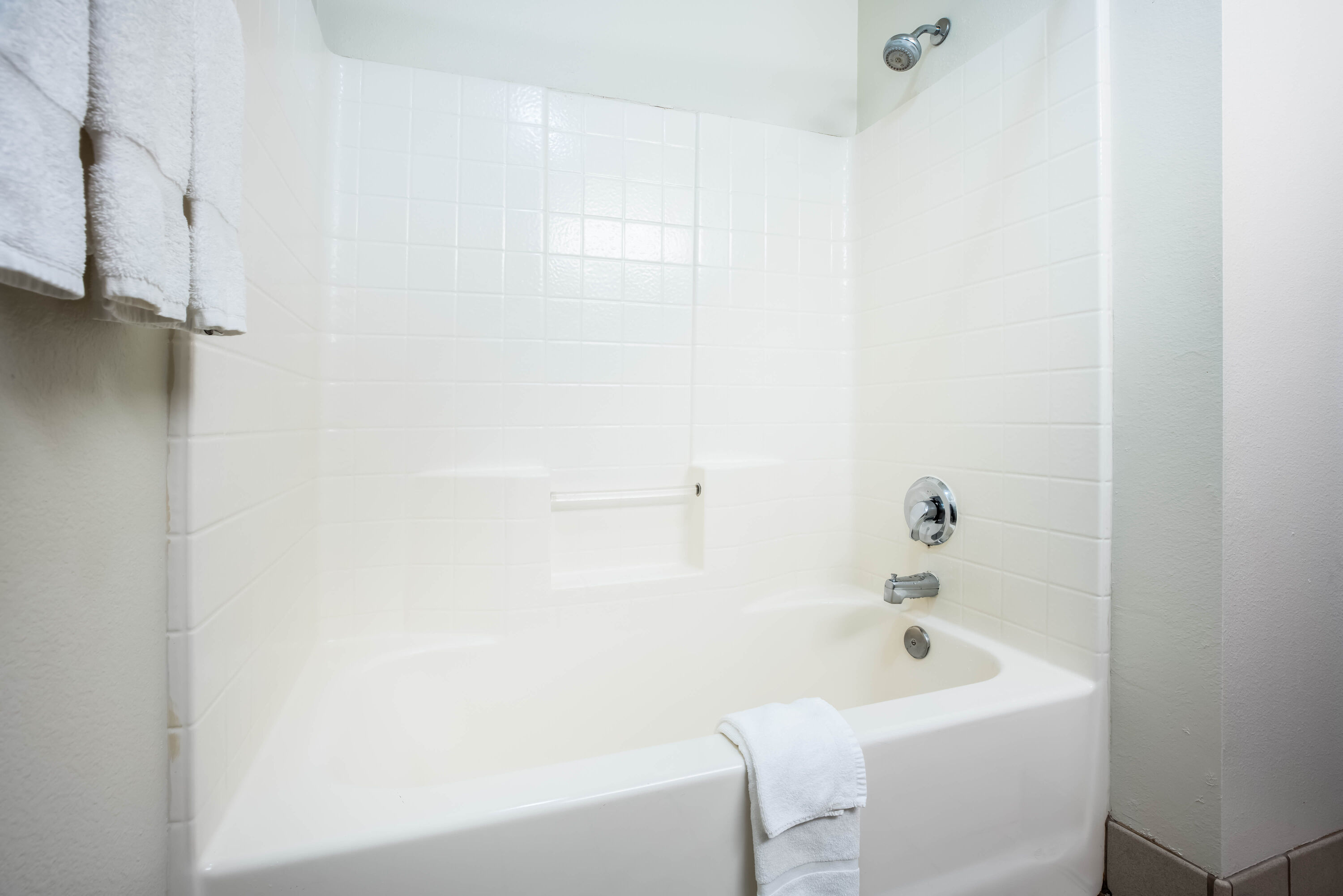 Guest room bath at the La Quinta Inn & Suites by Wyndham Portland Airport in Portland, Oregon