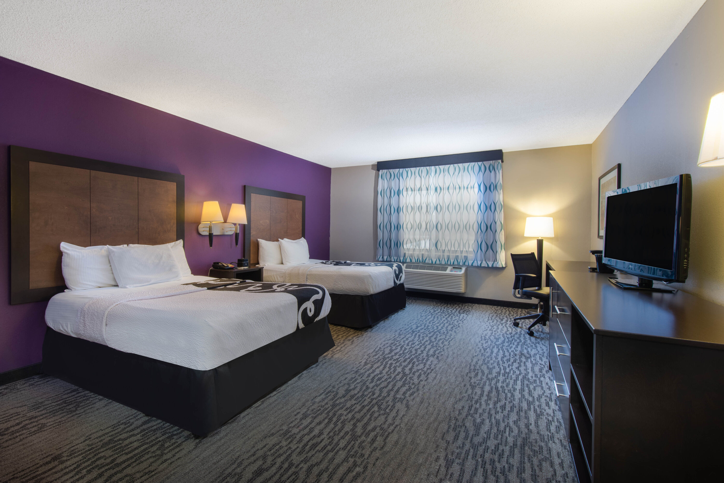 Guest room at the La Quinta Inn & Suites by Wyndham Erie in Erie, Pennsylvania
