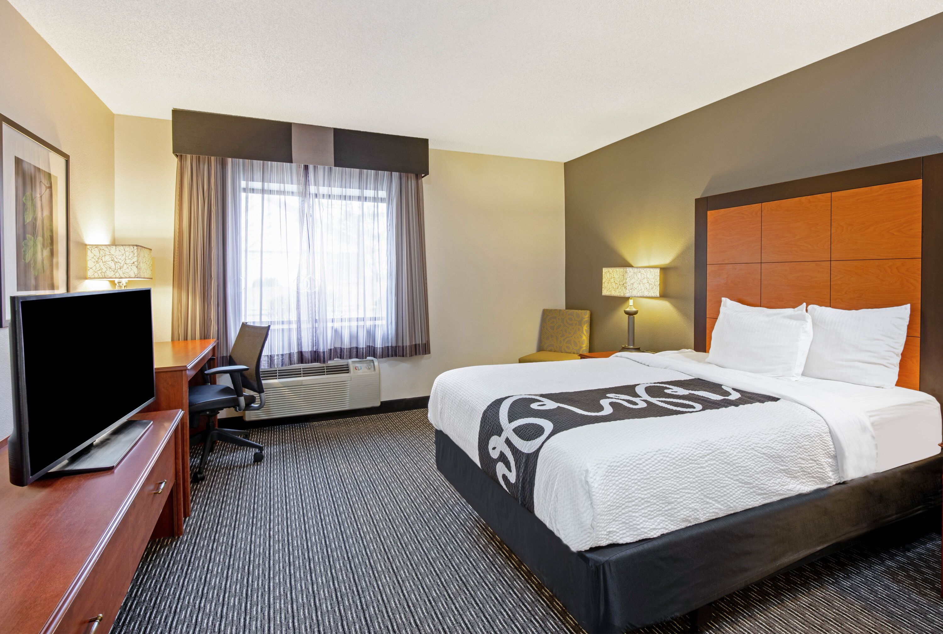 Guest room at the La Quinta Inn & Suites by Wyndham Harrisburg Airport Hershey in Harrisburg, Pennsylvania