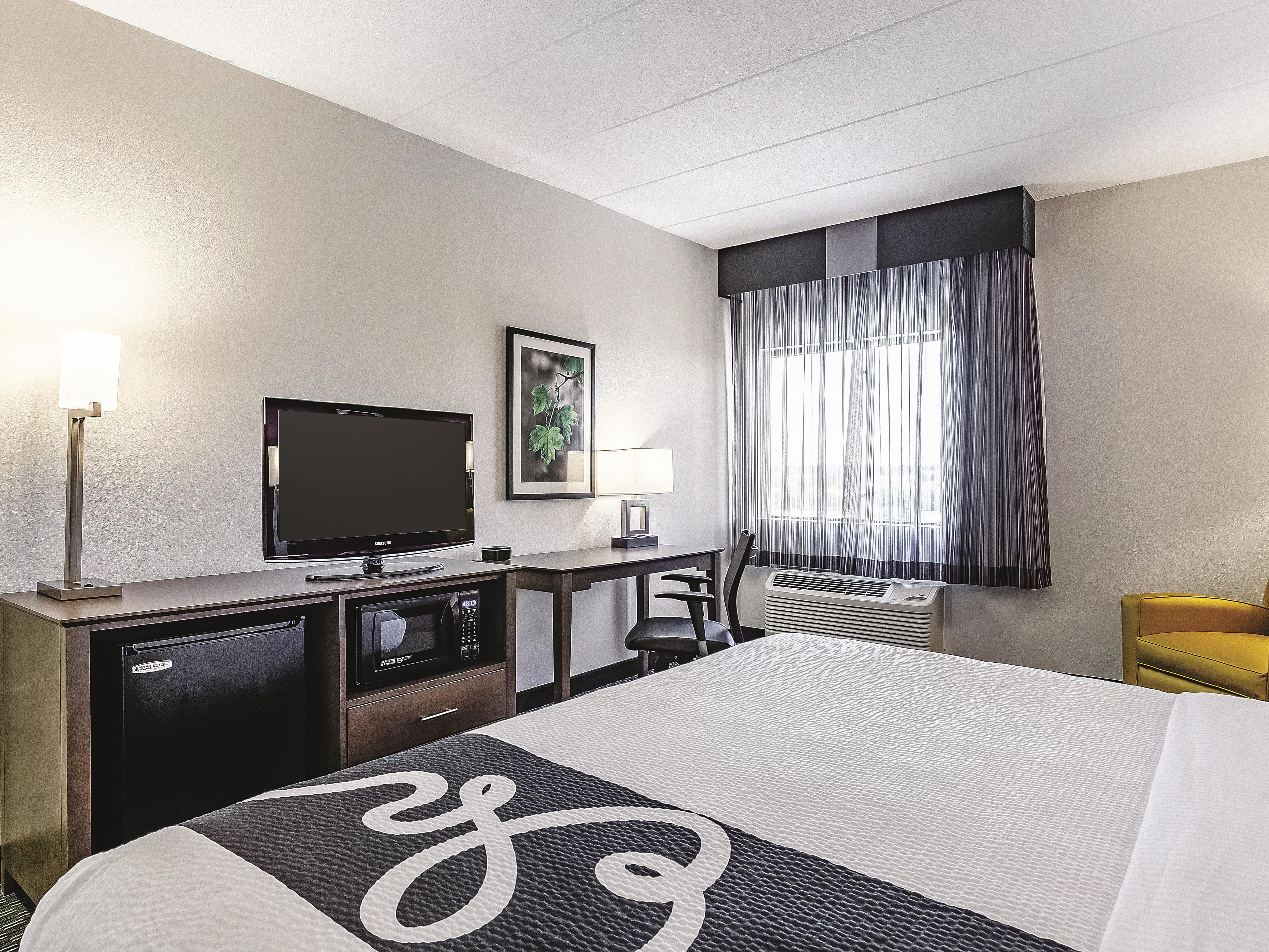 Guest room at the La Quinta Inn & Suites by Wyndham Warwick Providence Airport in Warwick, Rhode Island