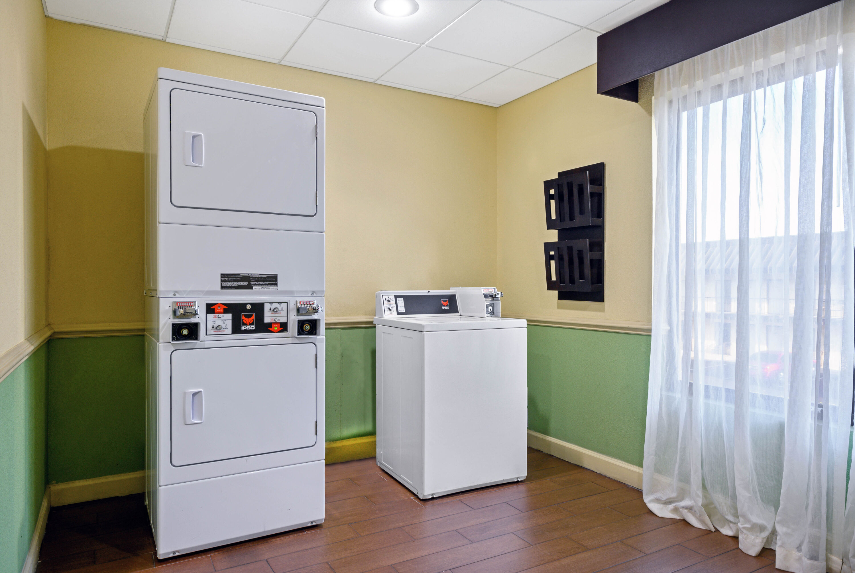 Laundry facilities at La Quinta Inn & Suites by Wyndham Florence in Florence, South Carolina