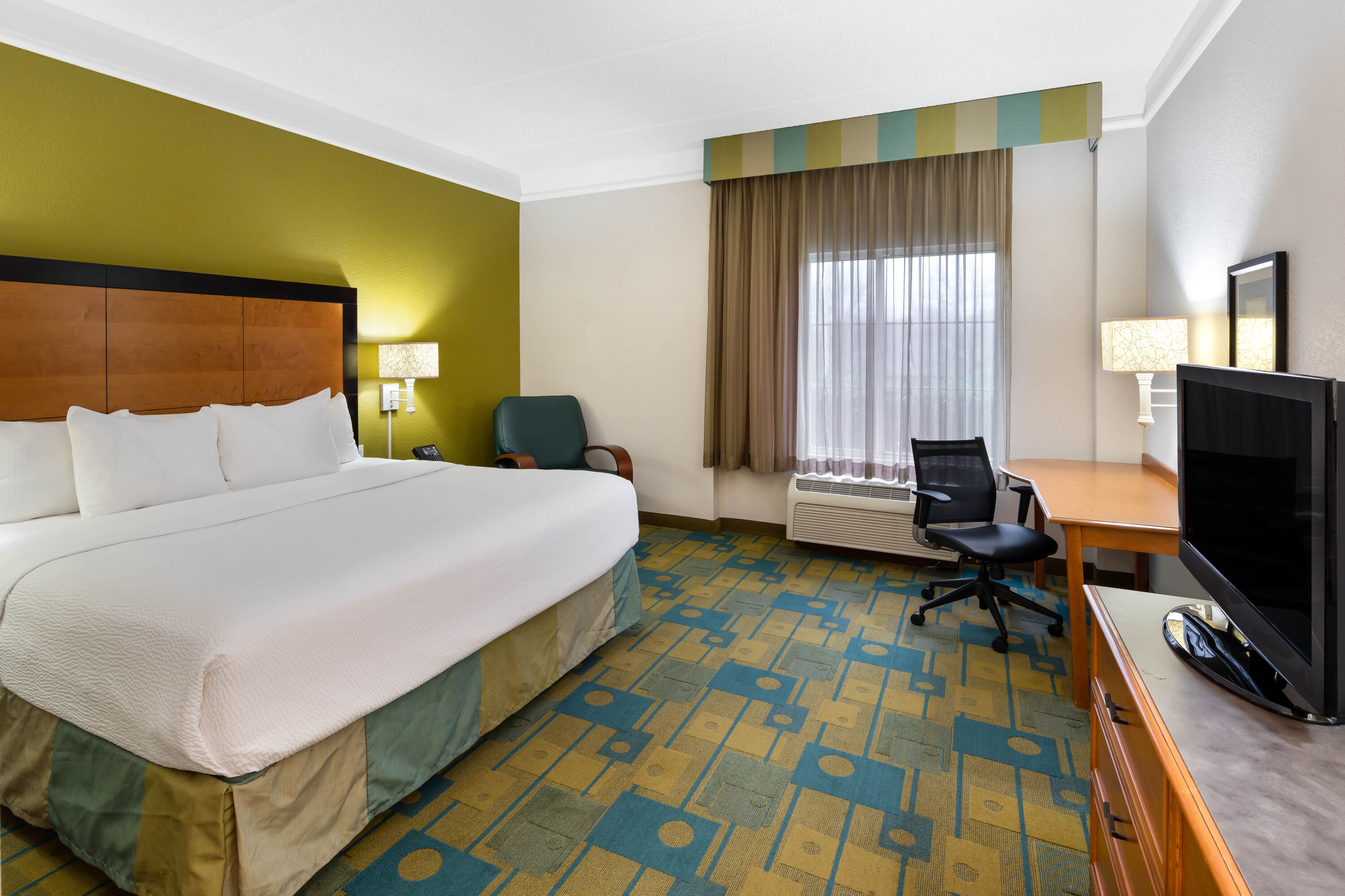 Guest room at the La Quinta Inn & Suites by Wyndham Greenville Haywood in Greenville, South Carolina