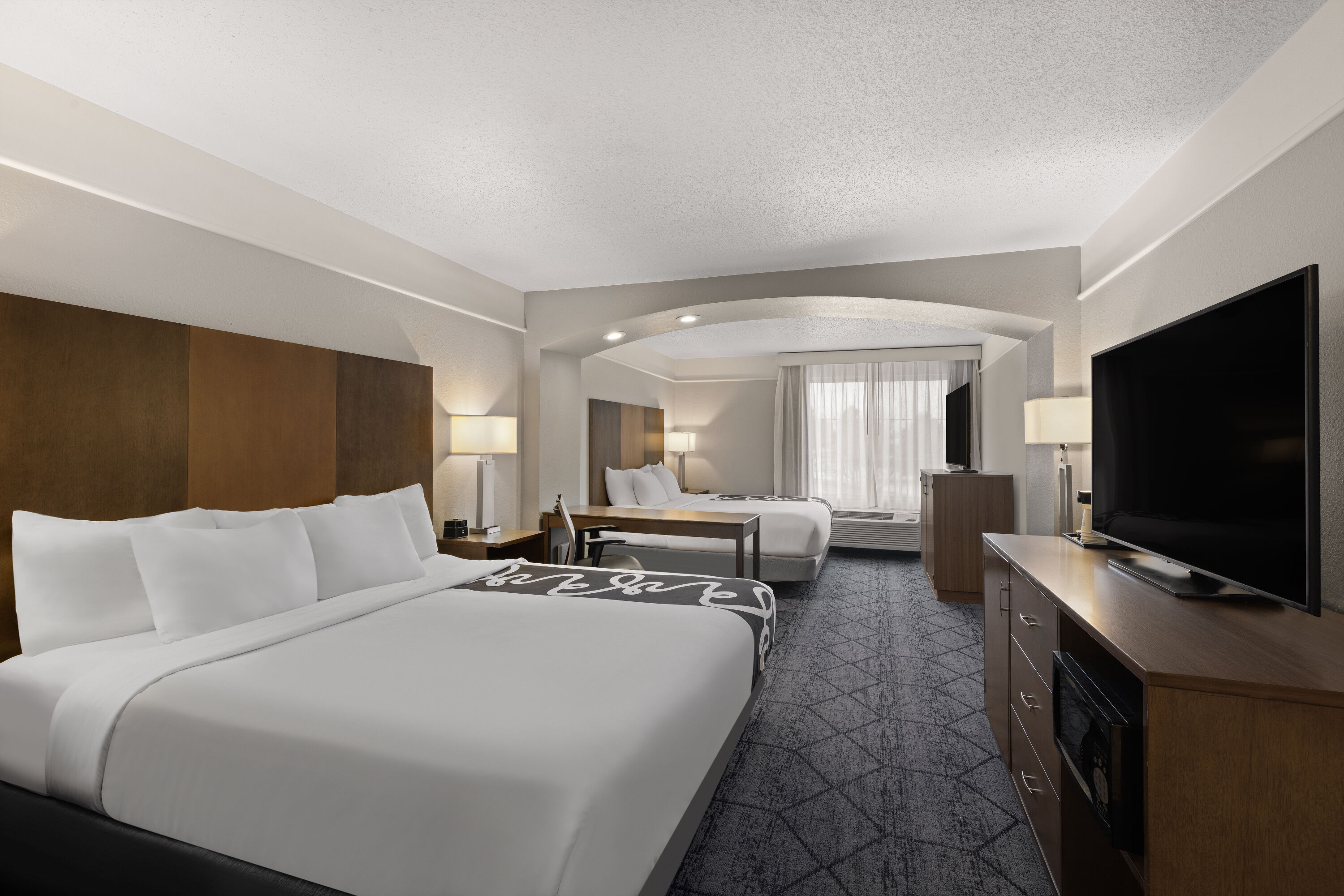 Guest room at the La Quinta Inn and Suites by Wyndham at WaTiki Waterpark in Rapid City, South Dakota