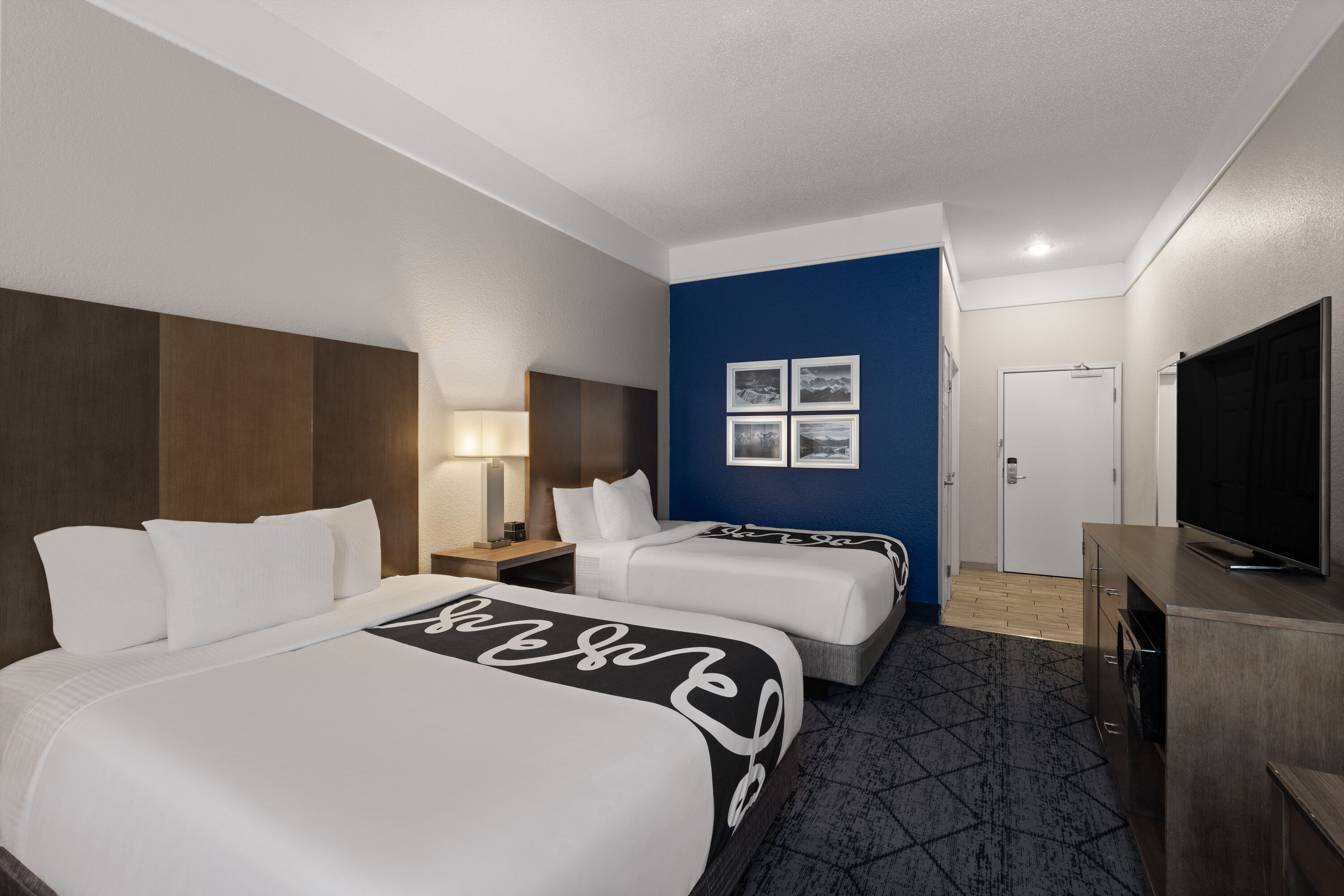 Guest room at the La Quinta Inn and Suites by Wyndham at WaTiki Waterpark in Rapid City, South Dakota