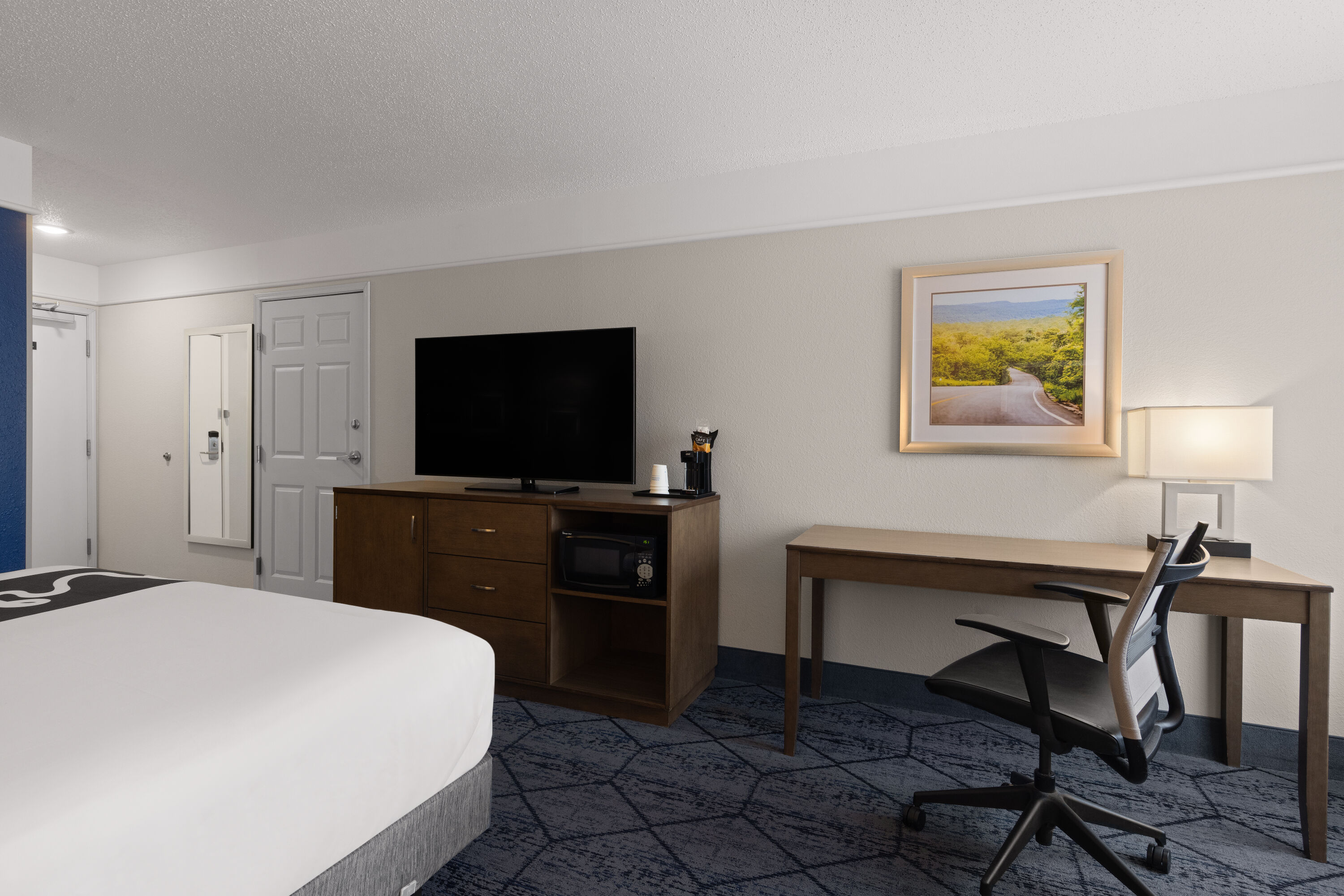 Guest room at the La Quinta Inn and Suites by Wyndham at WaTiki Waterpark in Rapid City, South Dakota
