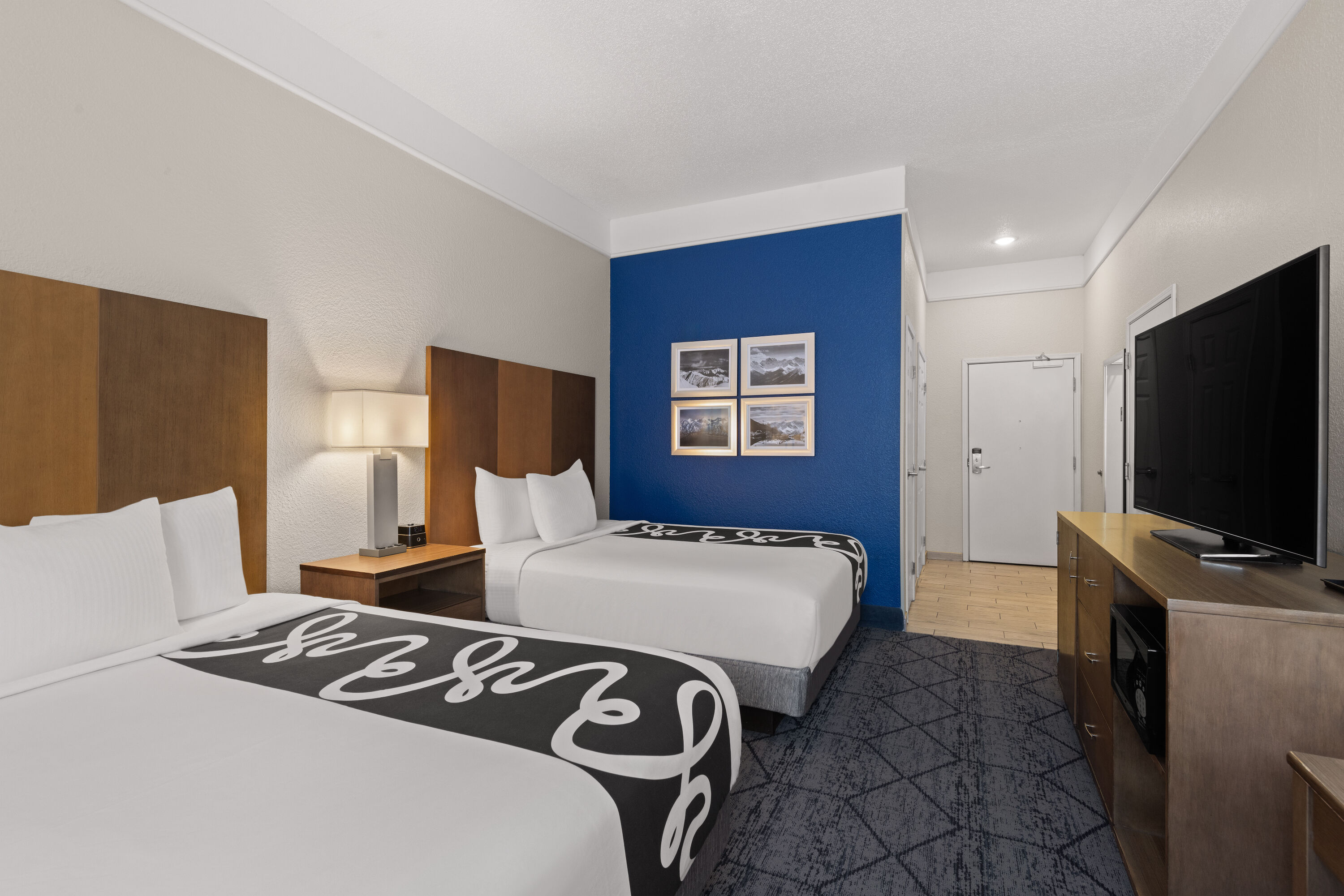 Guest room at the La Quinta Inn and Suites by Wyndham at WaTiki Waterpark in Rapid City, South Dakota