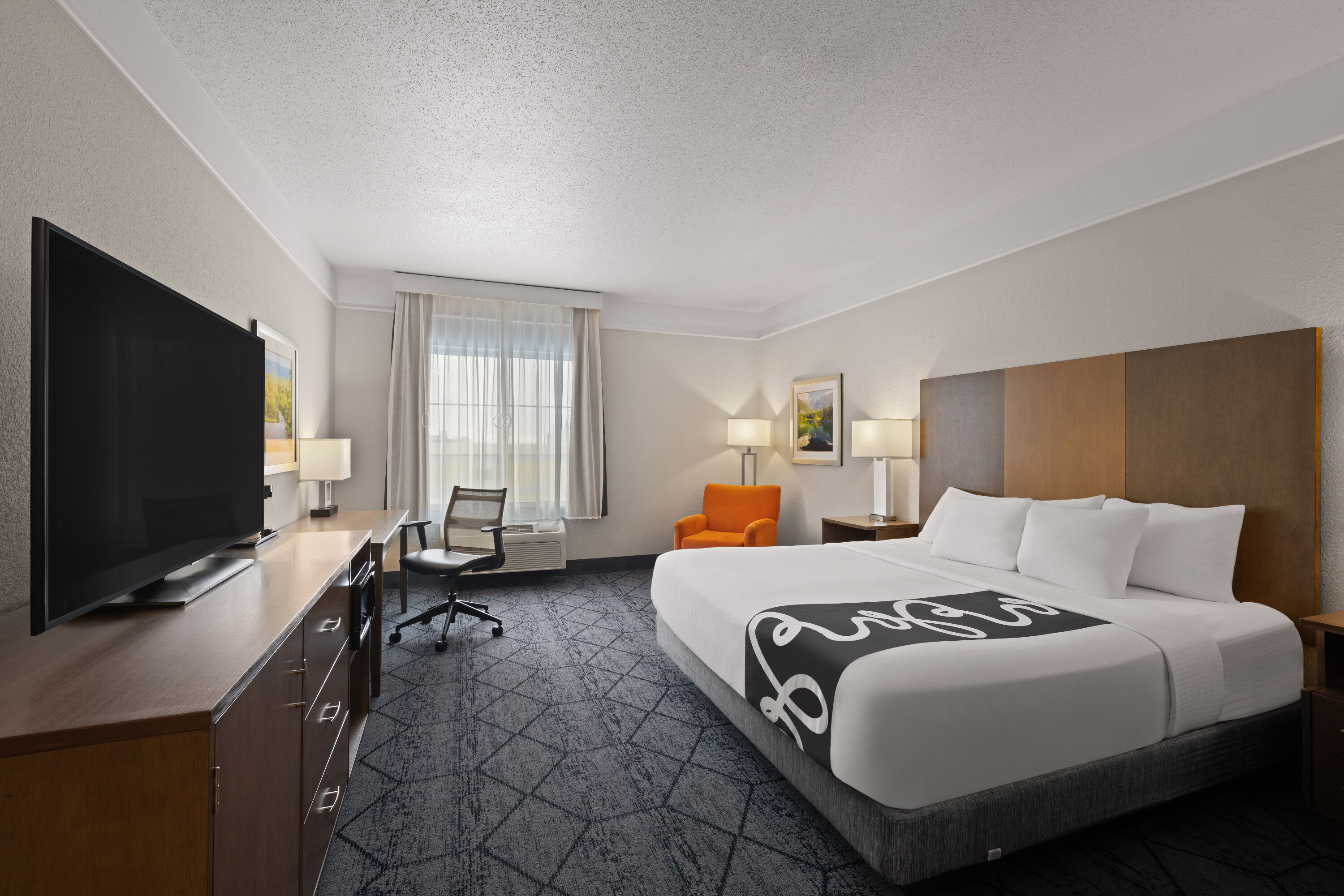 Guest room at the La Quinta Inn and Suites by Wyndham at WaTiki Waterpark in Rapid City, South Dakota