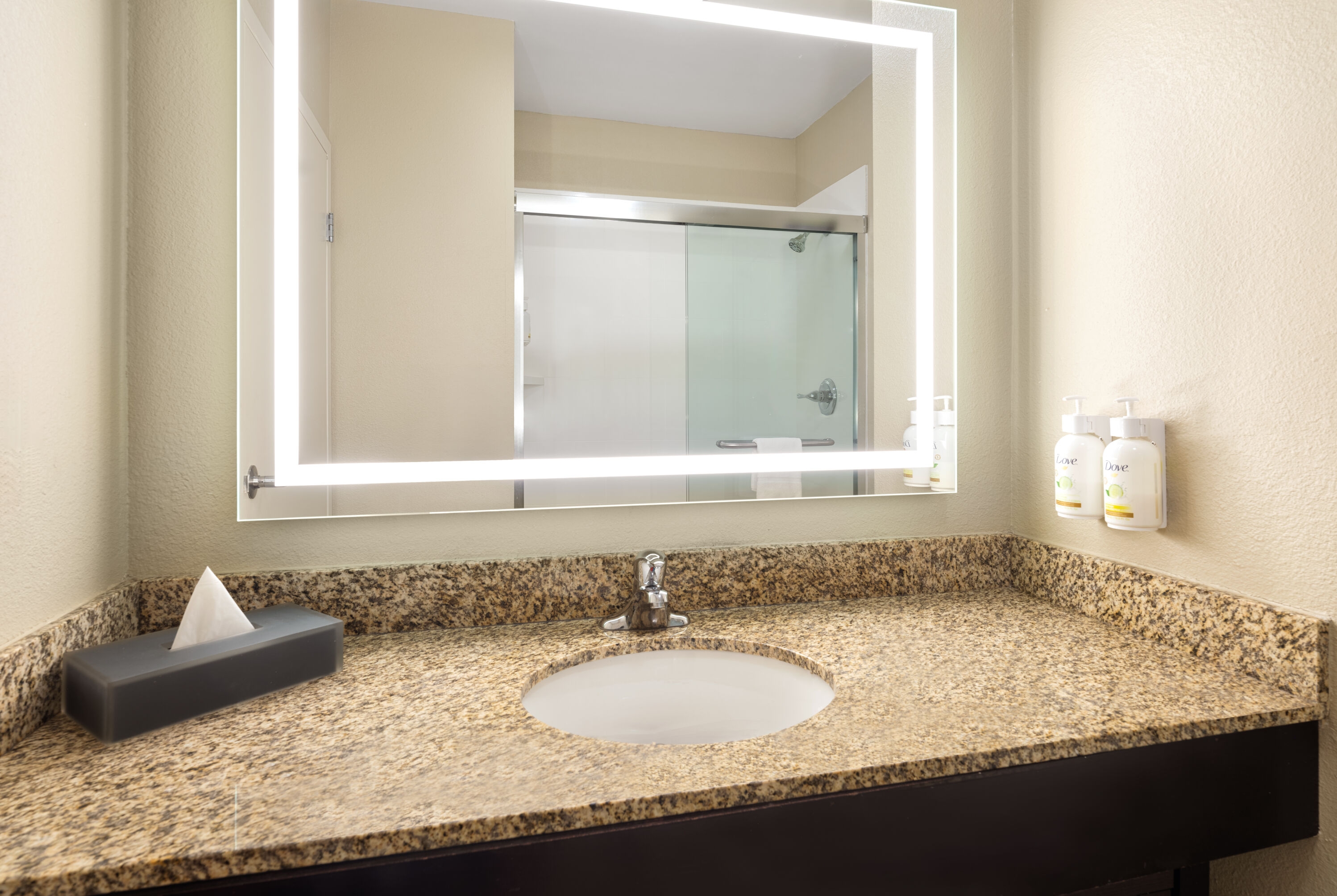 Guest room bath at the La Quinta Inn & Suites by Wyndham Knoxville Airport in Alcoa, Tennessee