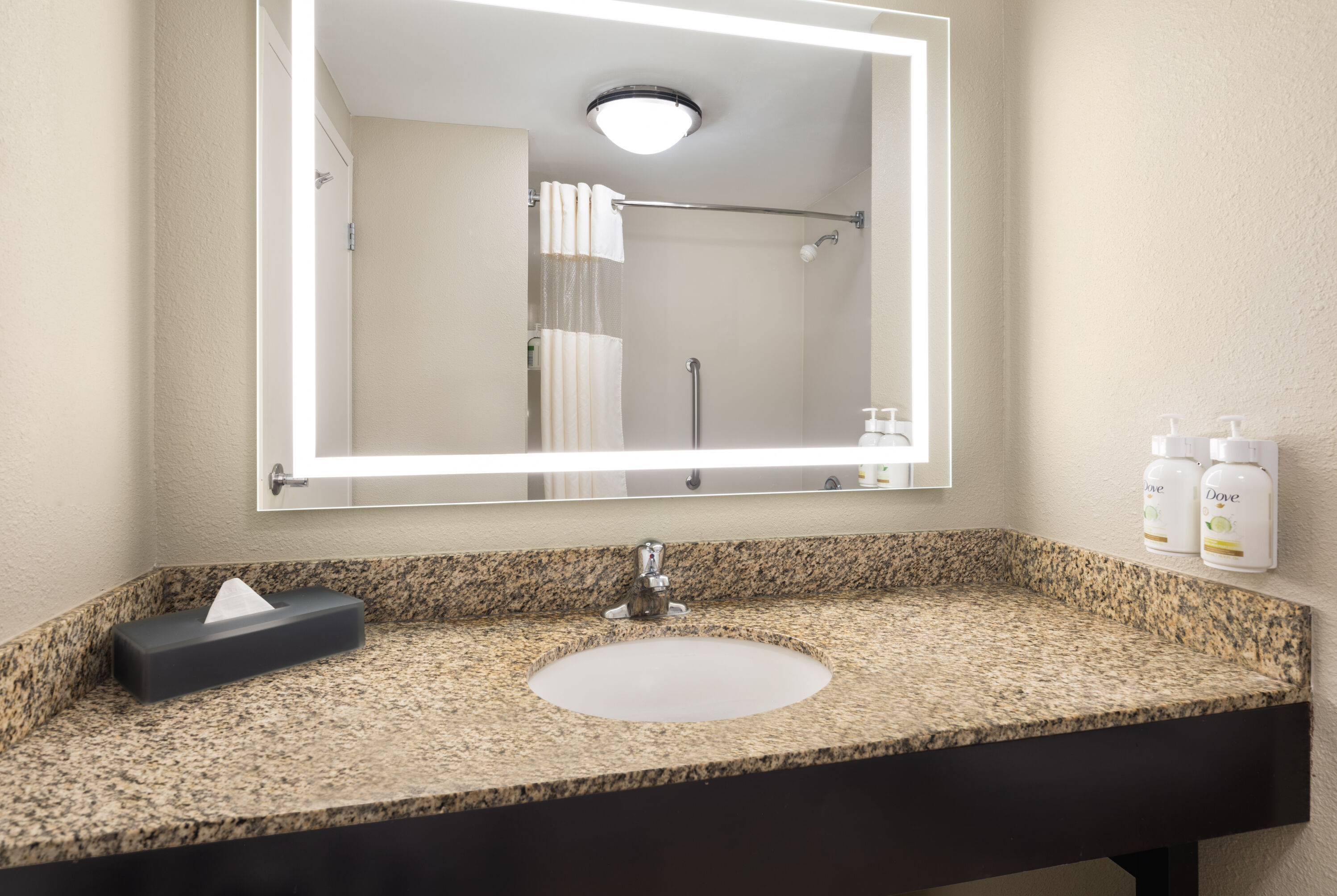 Guest room bath at the La Quinta Inn & Suites by Wyndham Knoxville Airport in Alcoa, Tennessee