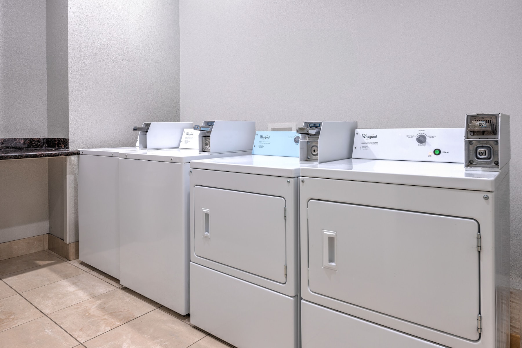 Laundry facilities at La Quinta Inn & Suites by Wyndham Alvarado in Alvarado, Texas