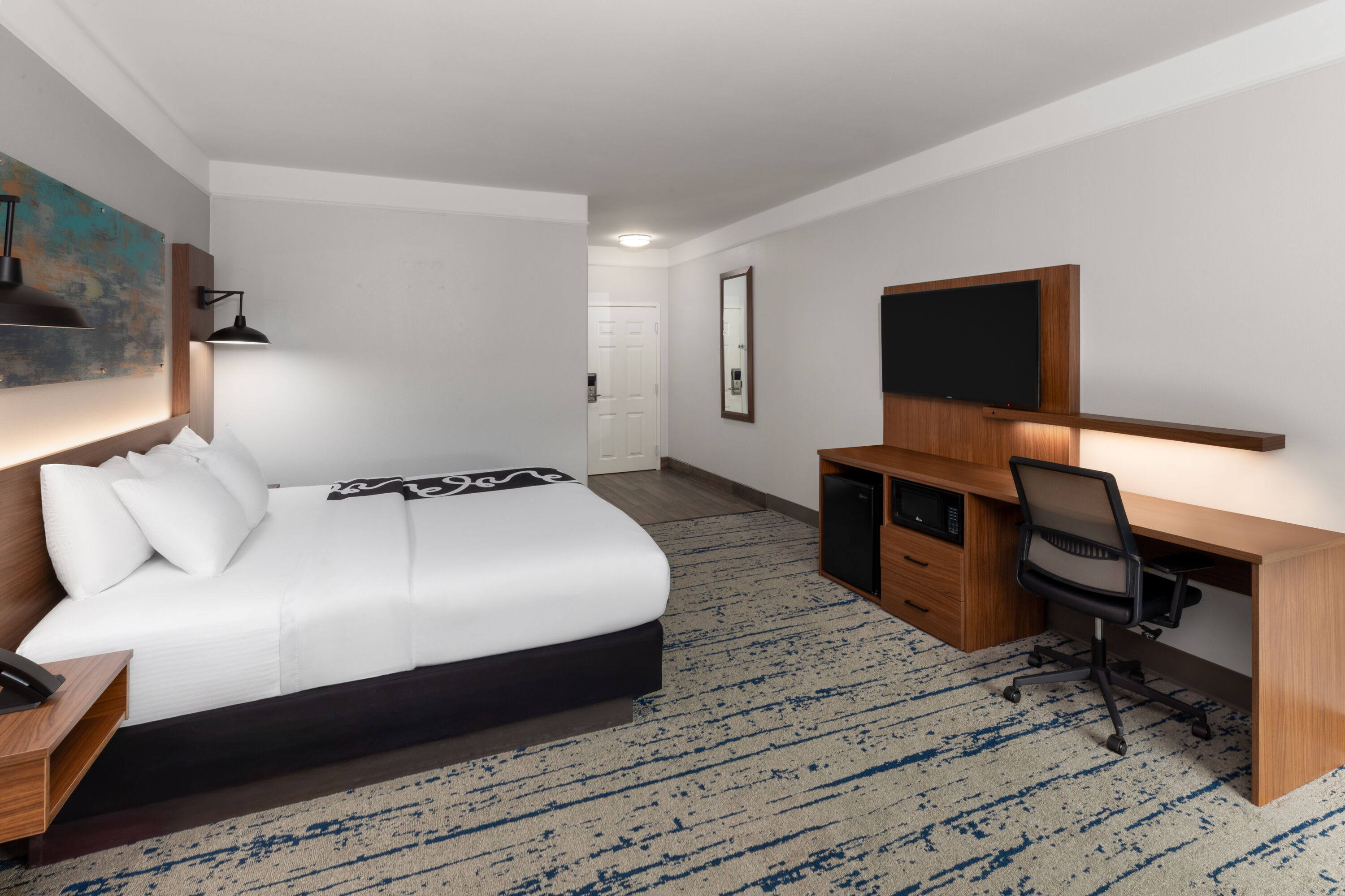 Guest room at the La Quinta Inn & Suites by Wyndham Angleton in Angleton, Texas