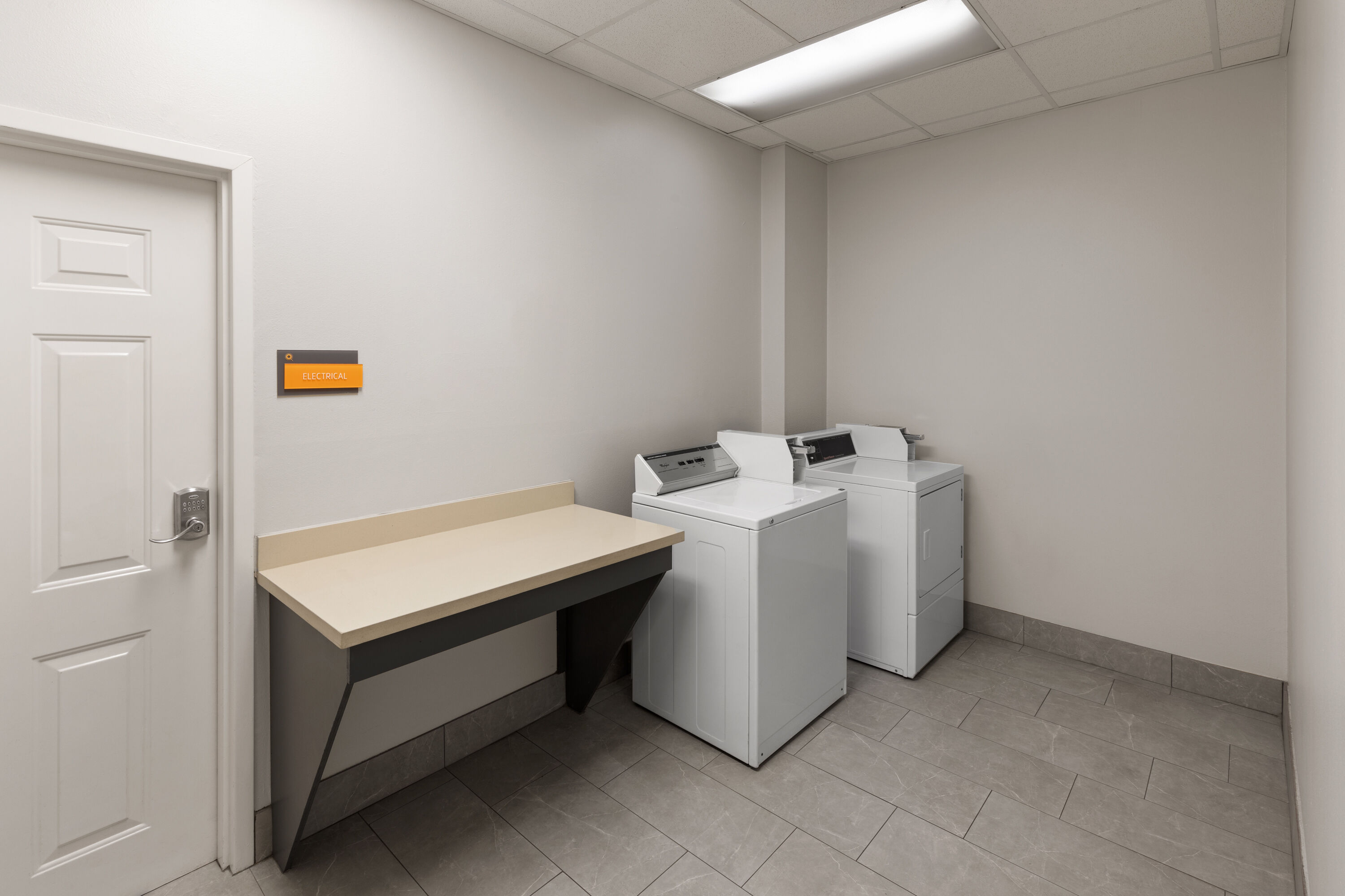 Laundry facilities at La Quinta Inn & Suites by Wyndham Angleton in Angleton, Texas