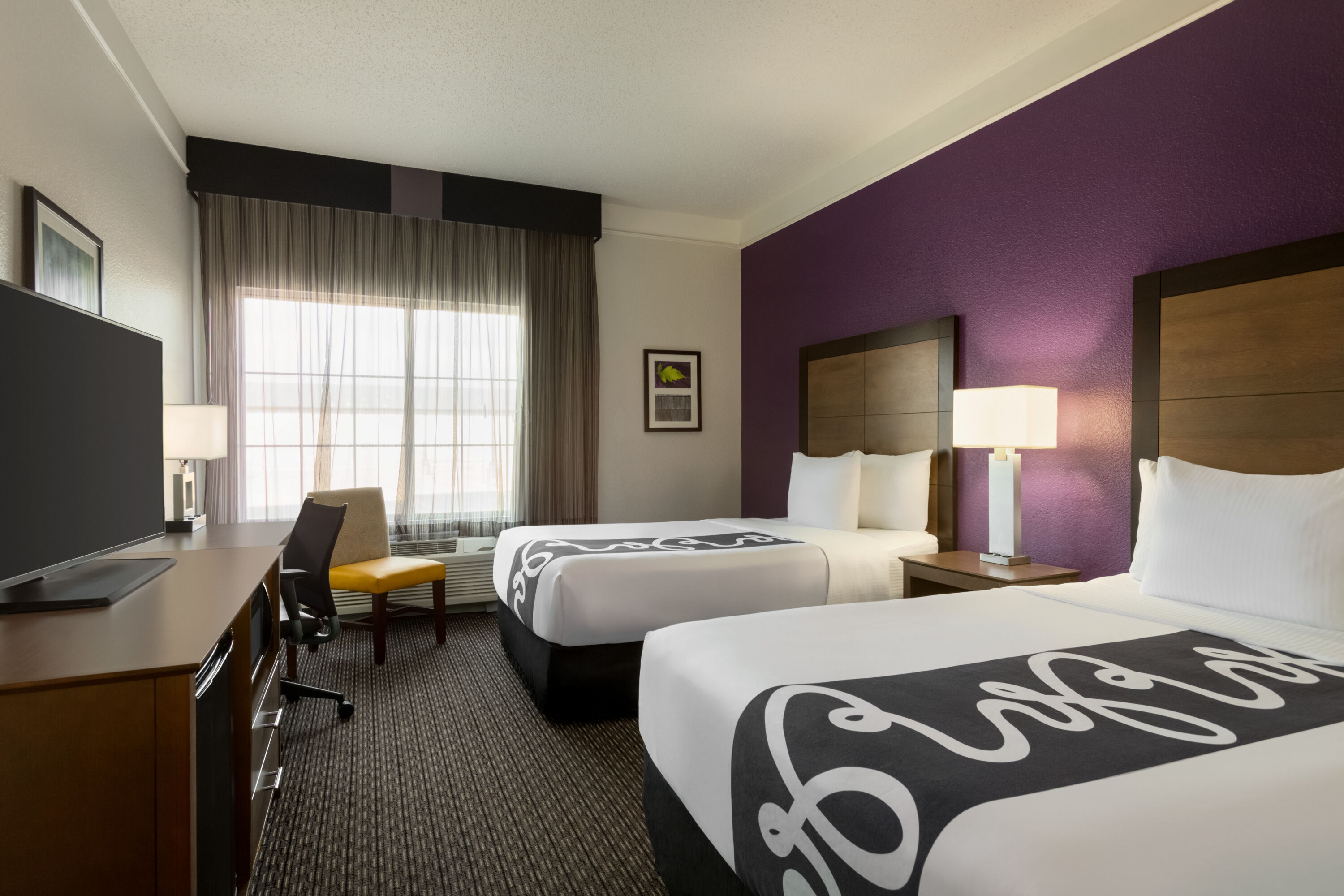 Guest room at the La Quinta Inn & Suites by Wyndham Arlington North 6 Flags Dr in Arlington, Texas