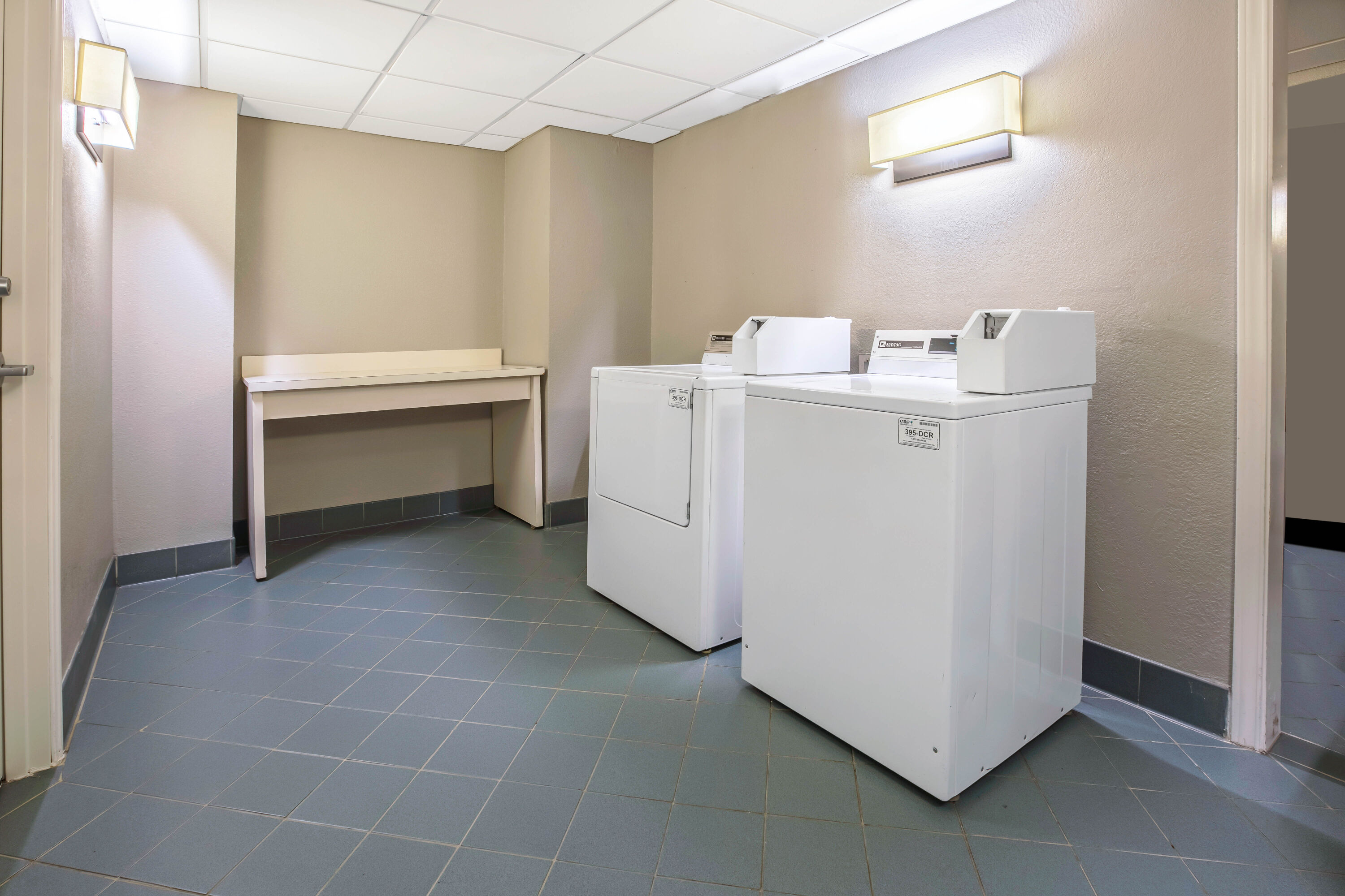 Laundry facilities at La Quinta Inn & Suites by Wyndham Dallas Arlington South in Arlington, Texas