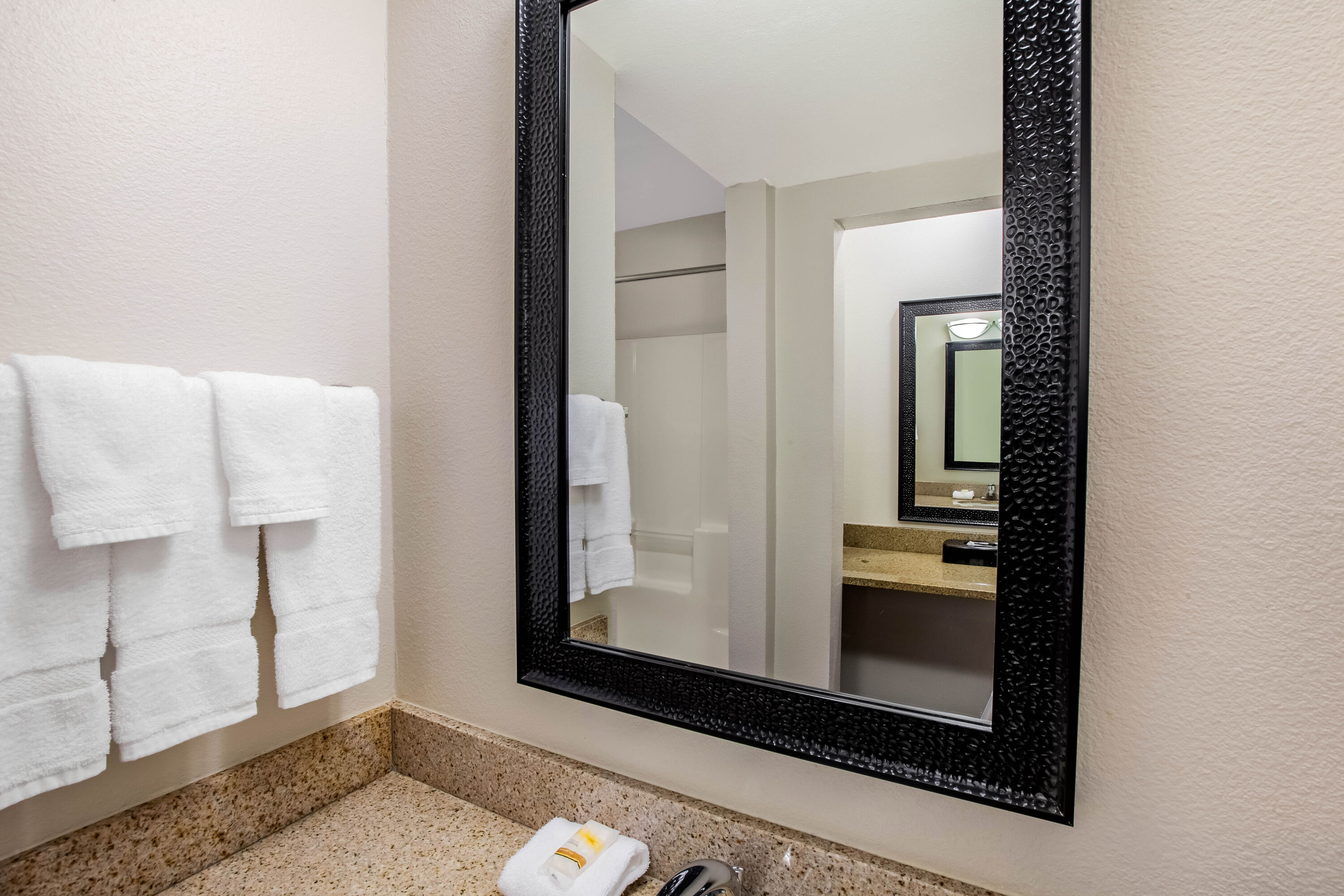 Guest room bath at the La Quinta Inn & Suites by Wyndham Houston Baytown East in Baytown, Texas