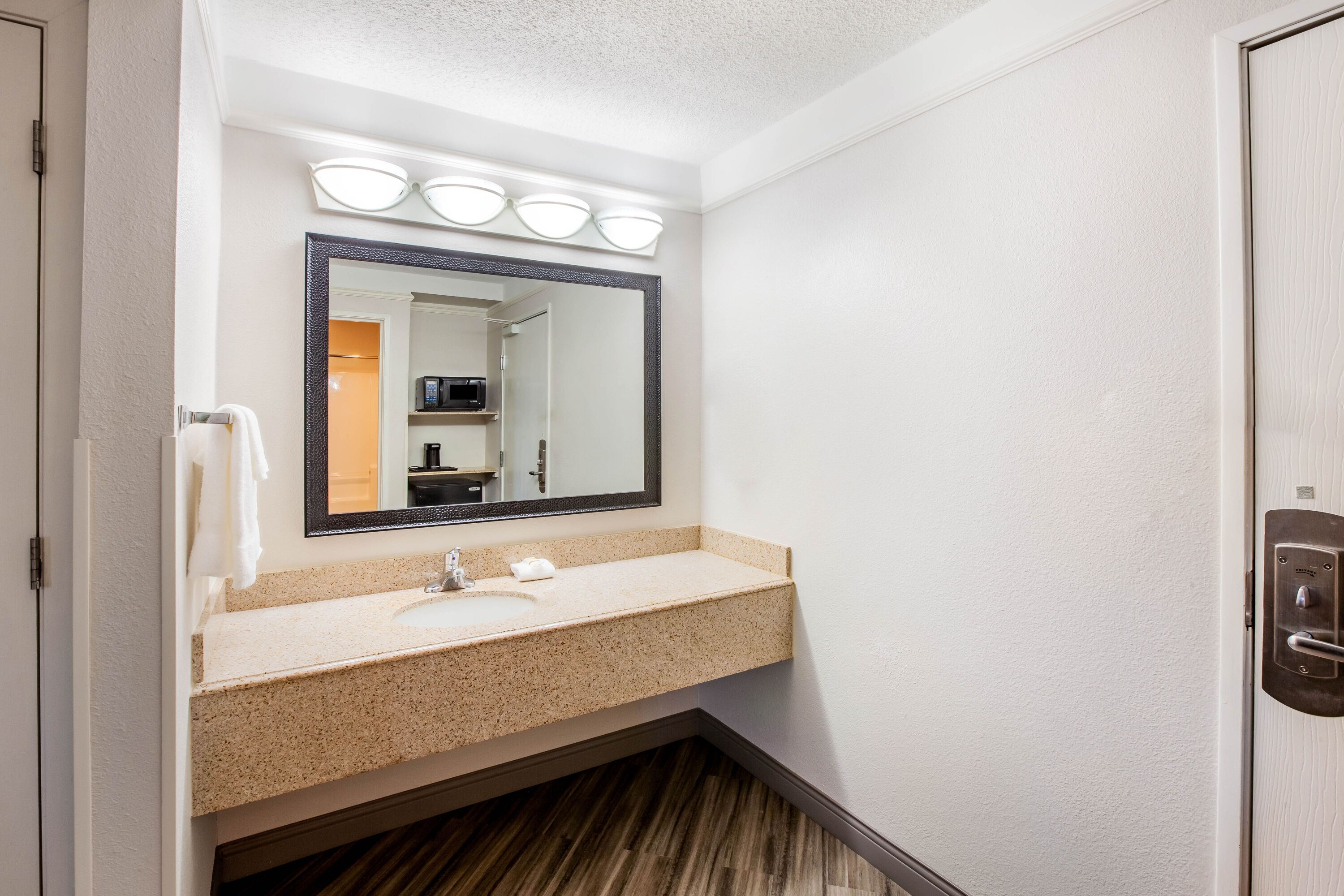 Guest room bath at the La Quinta Inn & Suites by Wyndham Houston Baytown East in Baytown, Texas