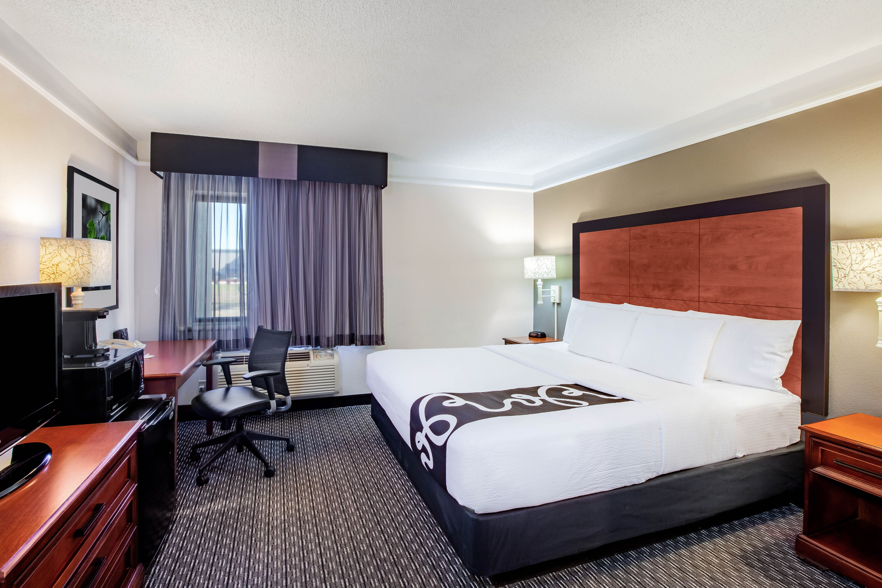 Guest room at the La Quinta Inn & Suites by Wyndham Houston Baytown East in Baytown, Texas