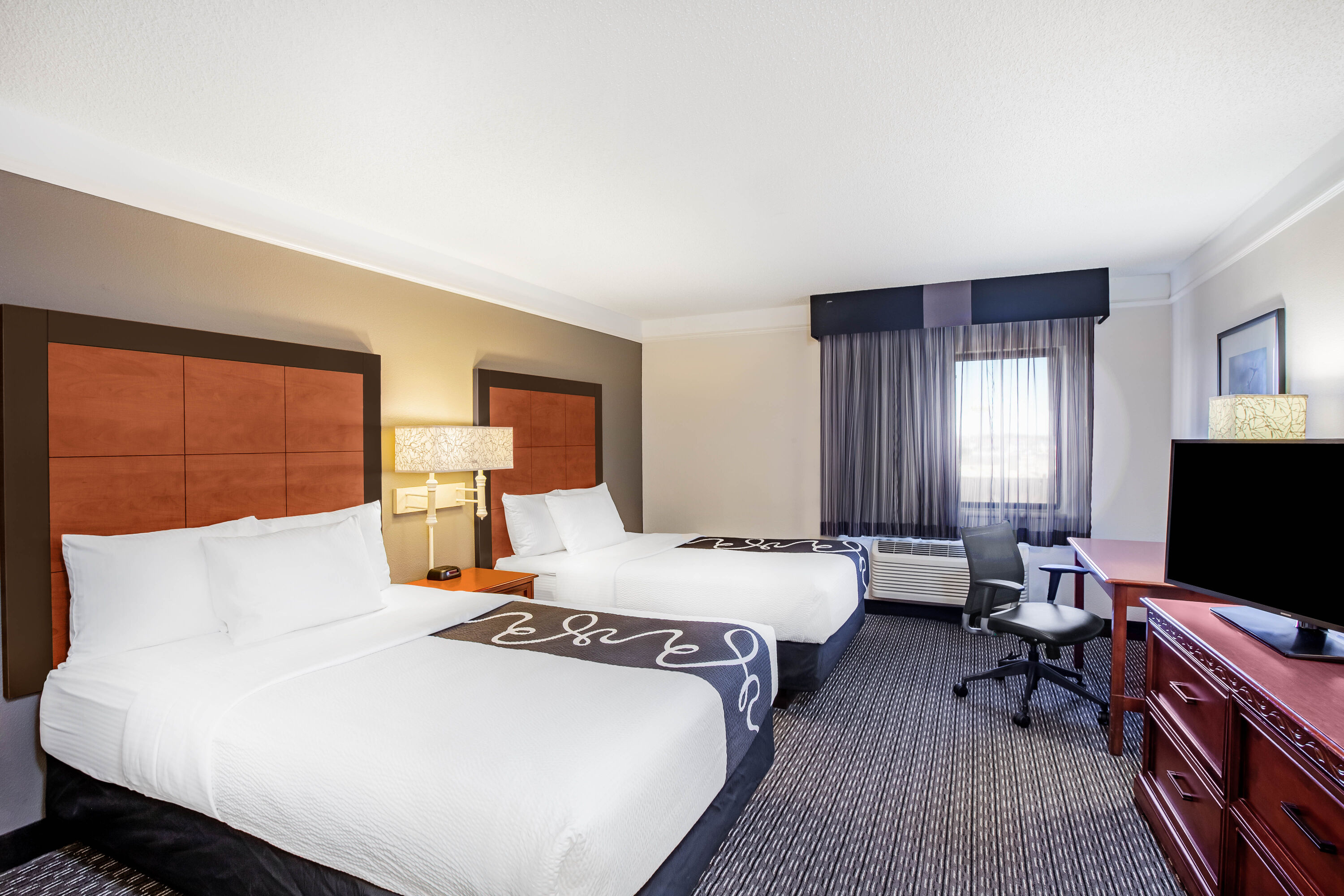 Guest room at the La Quinta Inn & Suites by Wyndham Houston Baytown East in Baytown, Texas