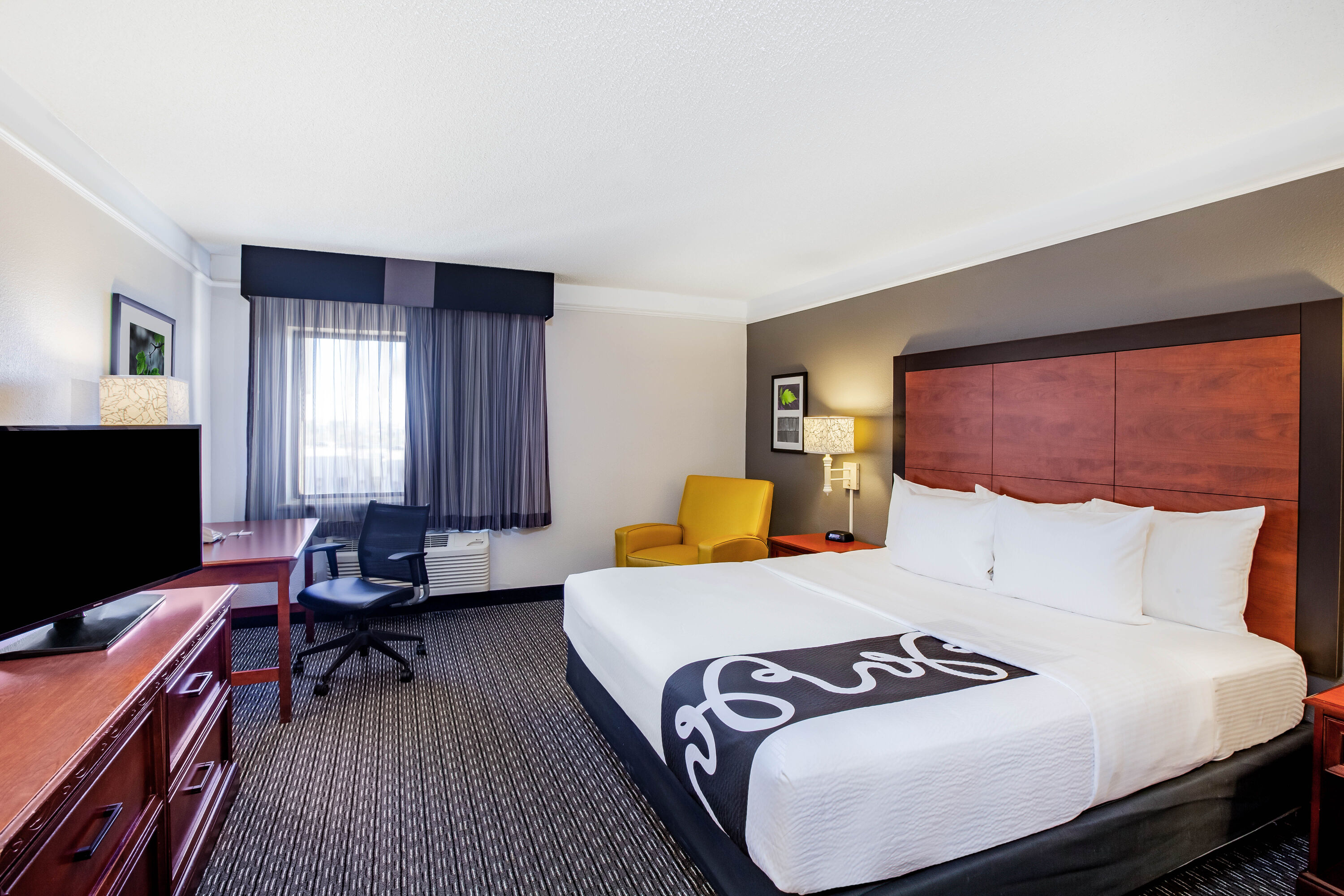 Guest room at the La Quinta Inn & Suites by Wyndham Houston Baytown East in Baytown, Texas