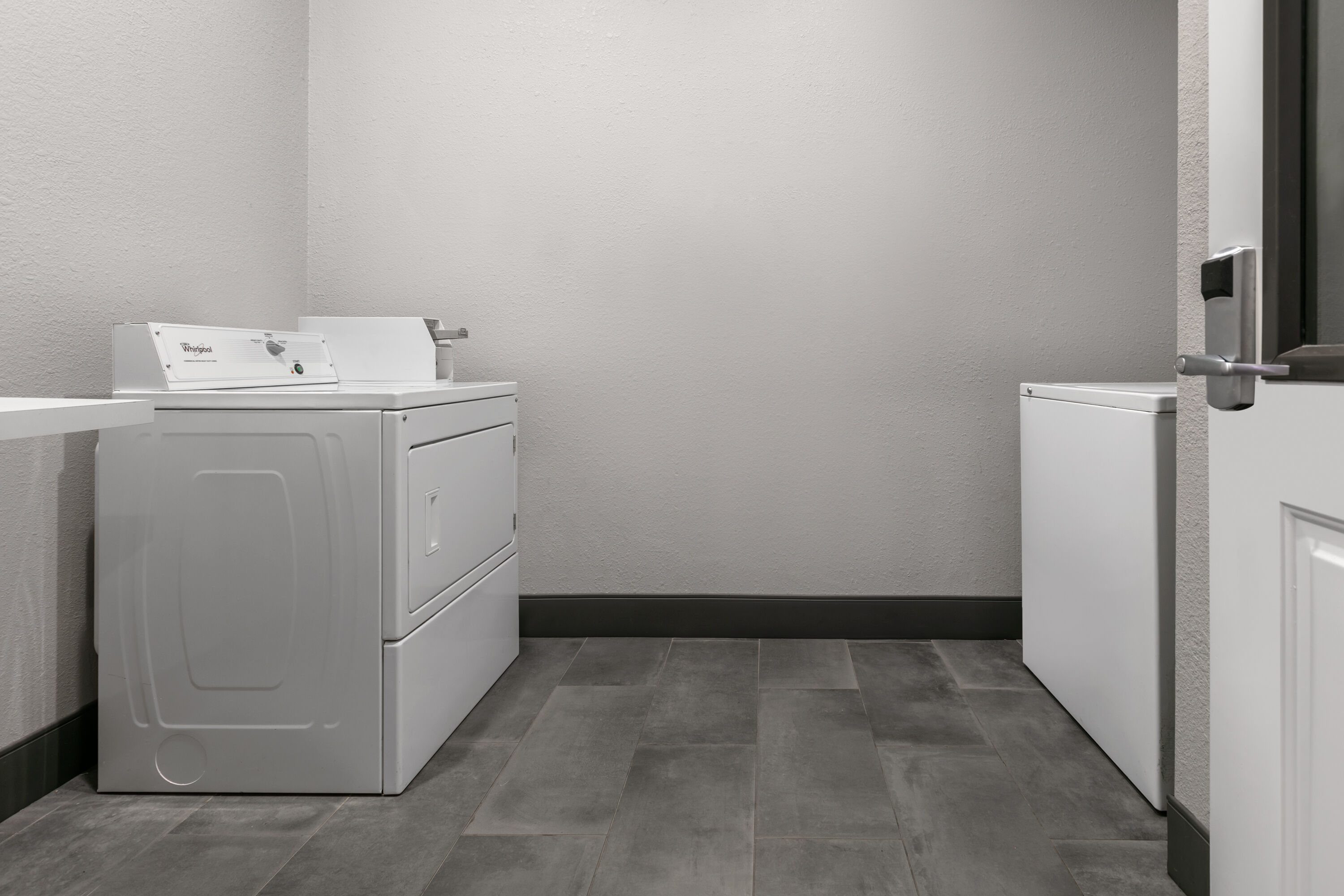 Laundry facilities at La Quinta Inn & Suites by Wyndham Belton - Temple South in Belton, Texas