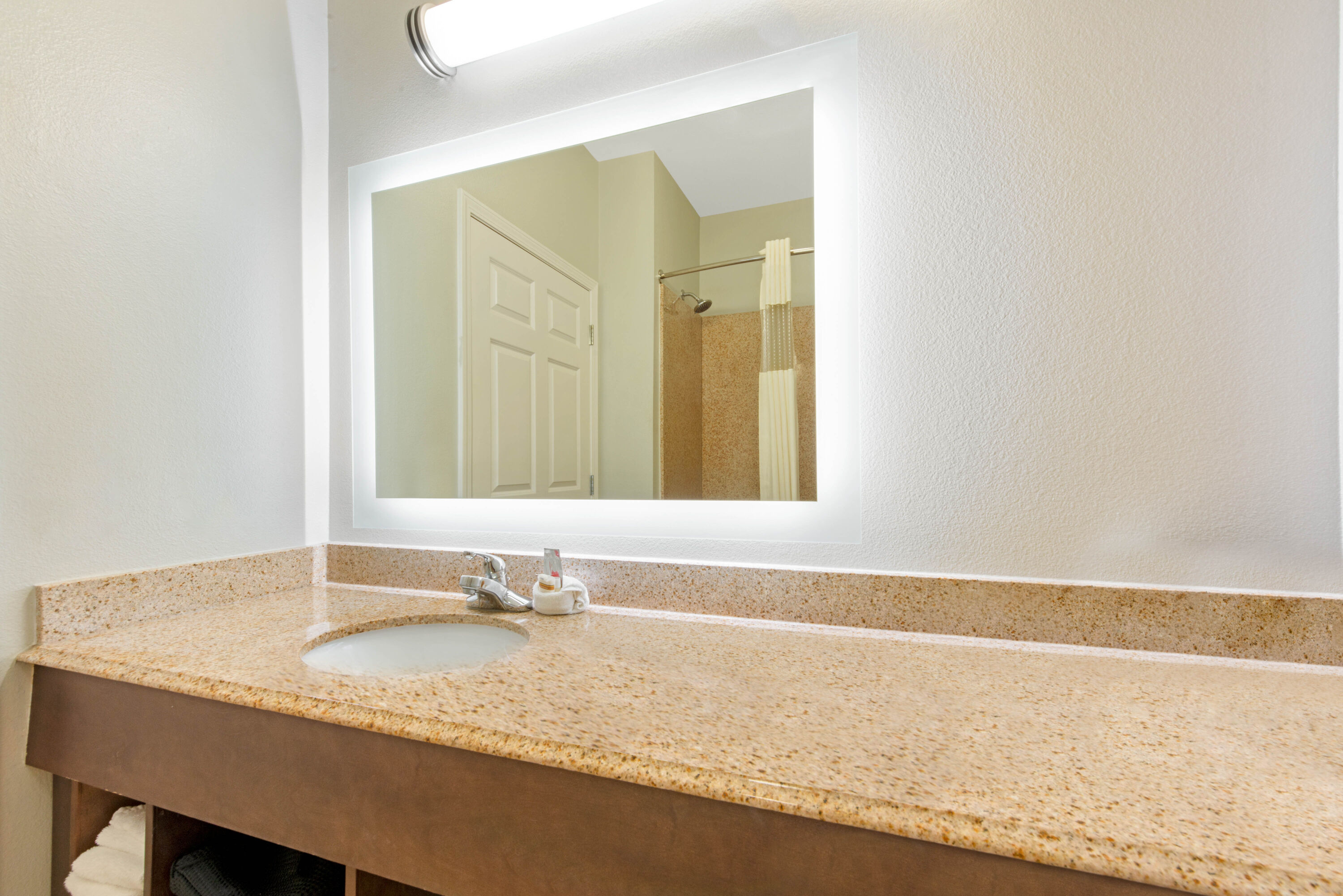 Guest room bath at the La Quinta Inn & Suites by Wyndham Bridge City in Bridge City, Texas