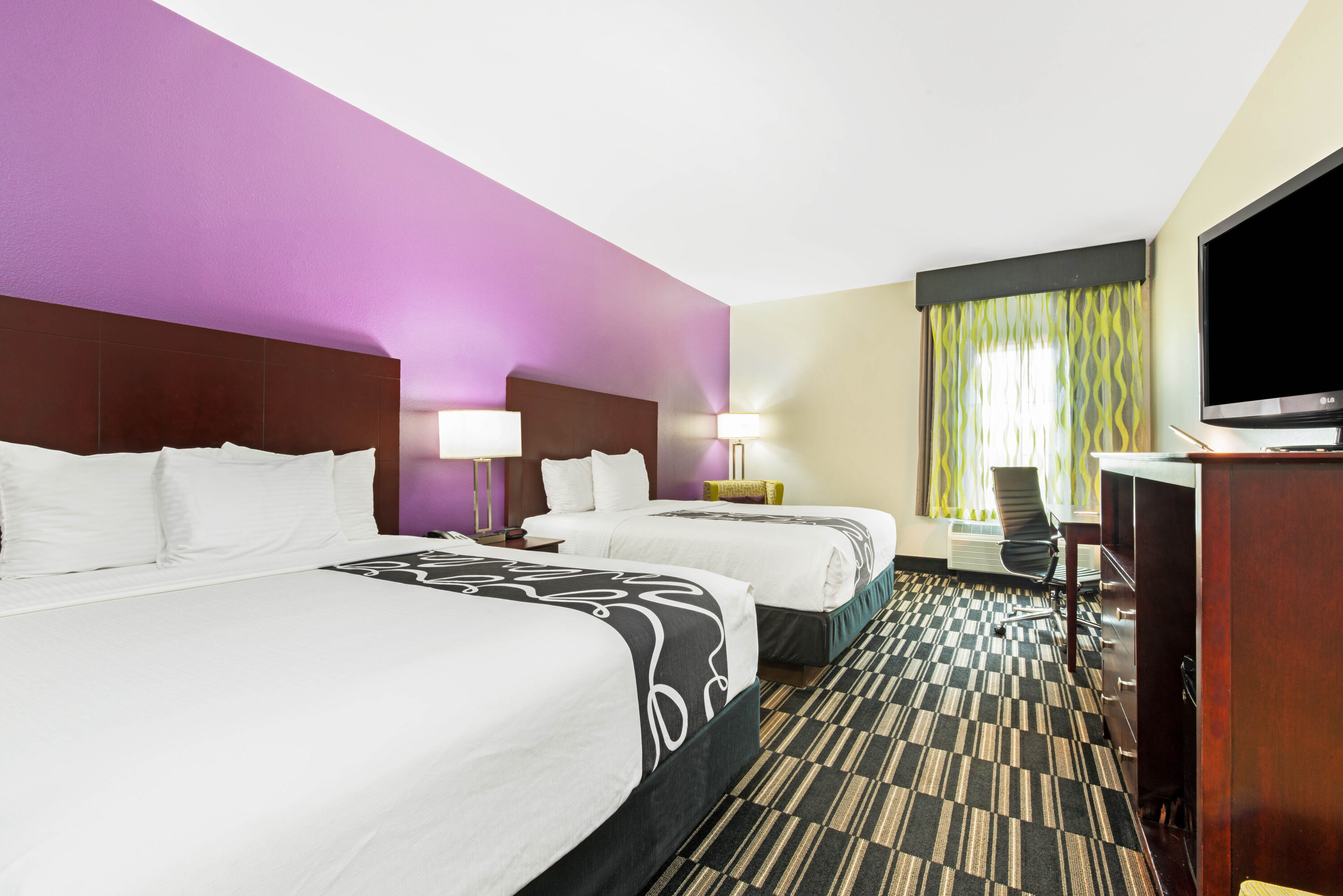 Guest room at the La Quinta Inn & Suites by Wyndham Bridge City in Bridge City, Texas