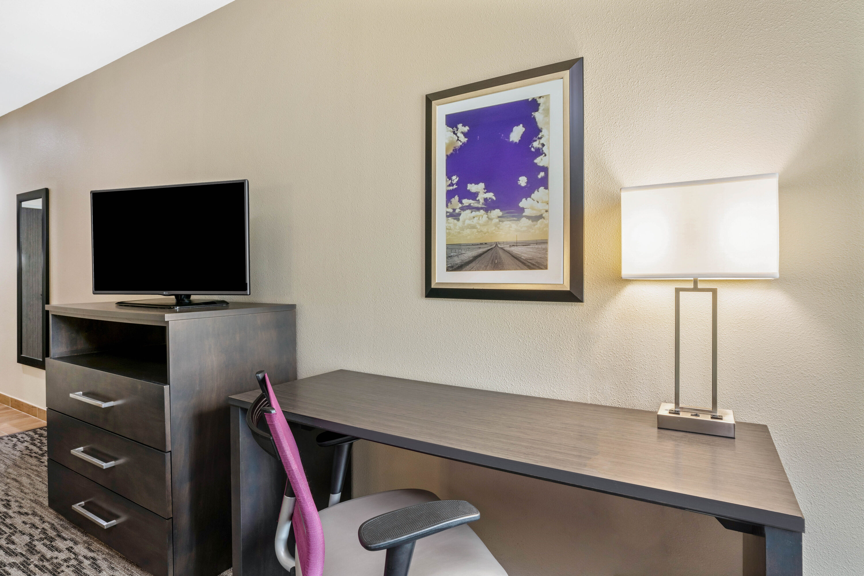 Guest room feature at the La Quinta Inn & Suites by Wyndham College Station South in College Station, Texas