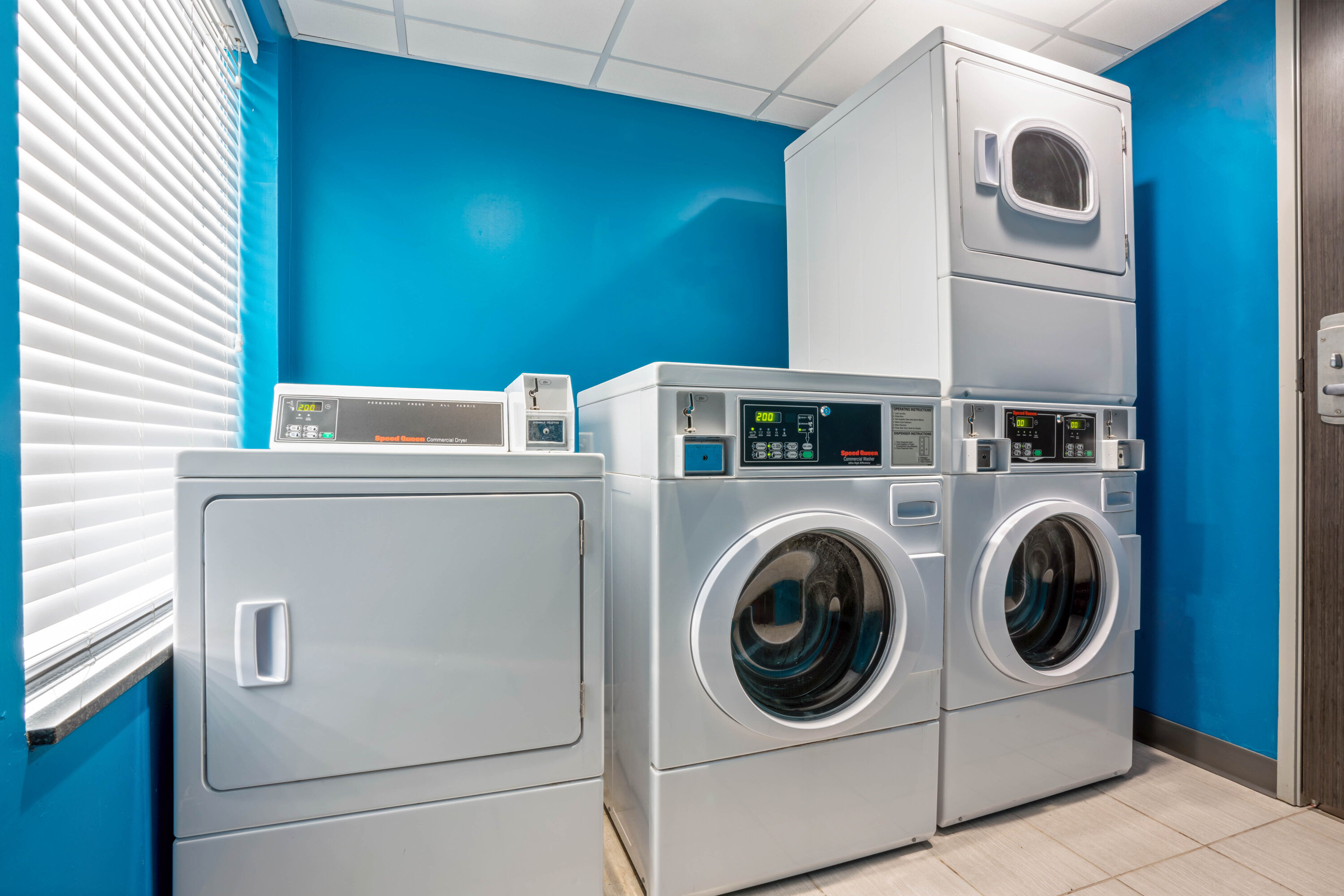 Laundry facilities at La Quinta Inn & Suites by Wyndham College Station South in College Station, Texas