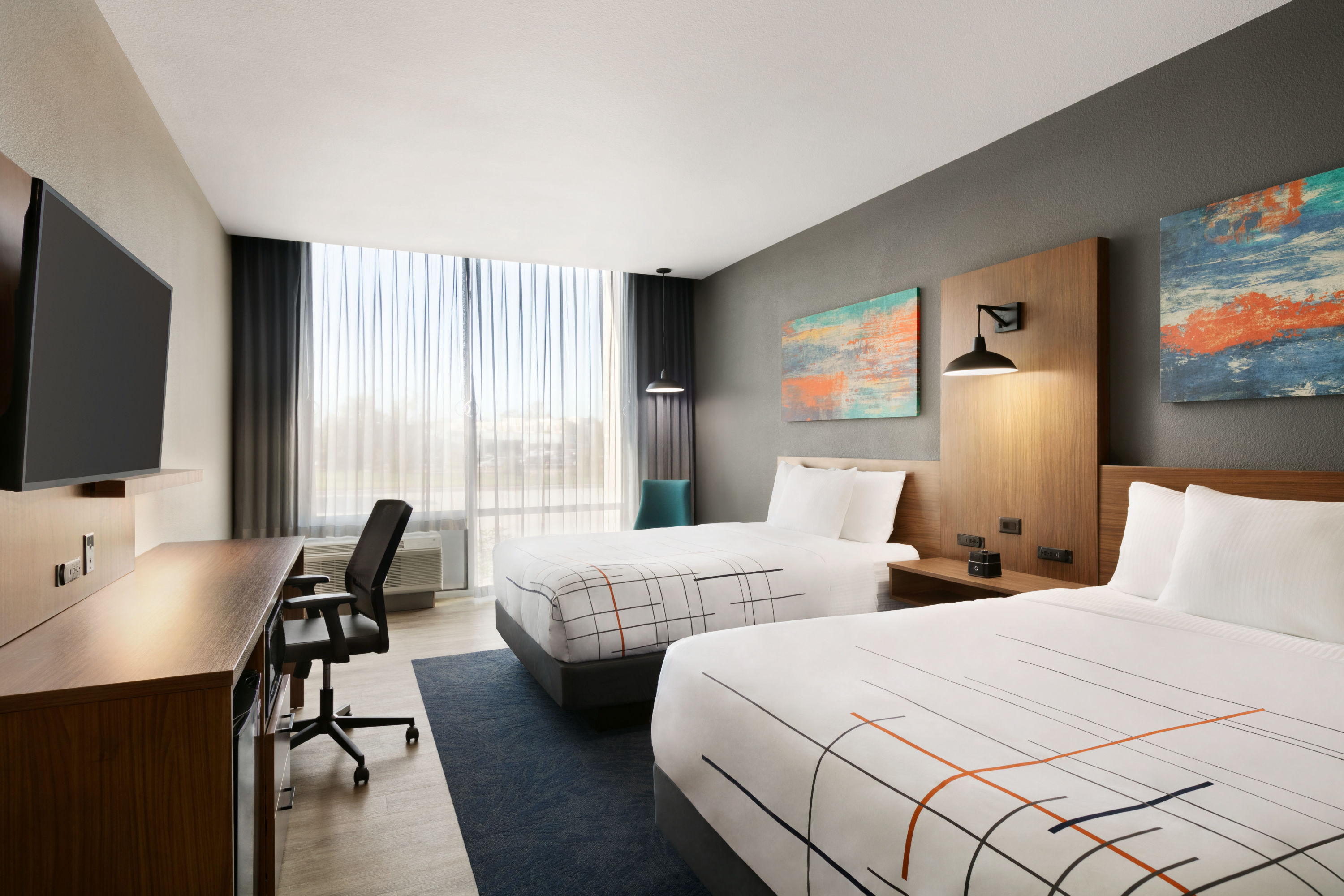 Guest room at the La Quinta Inn & Suites by Wyndham College Station North in College Station, Texas