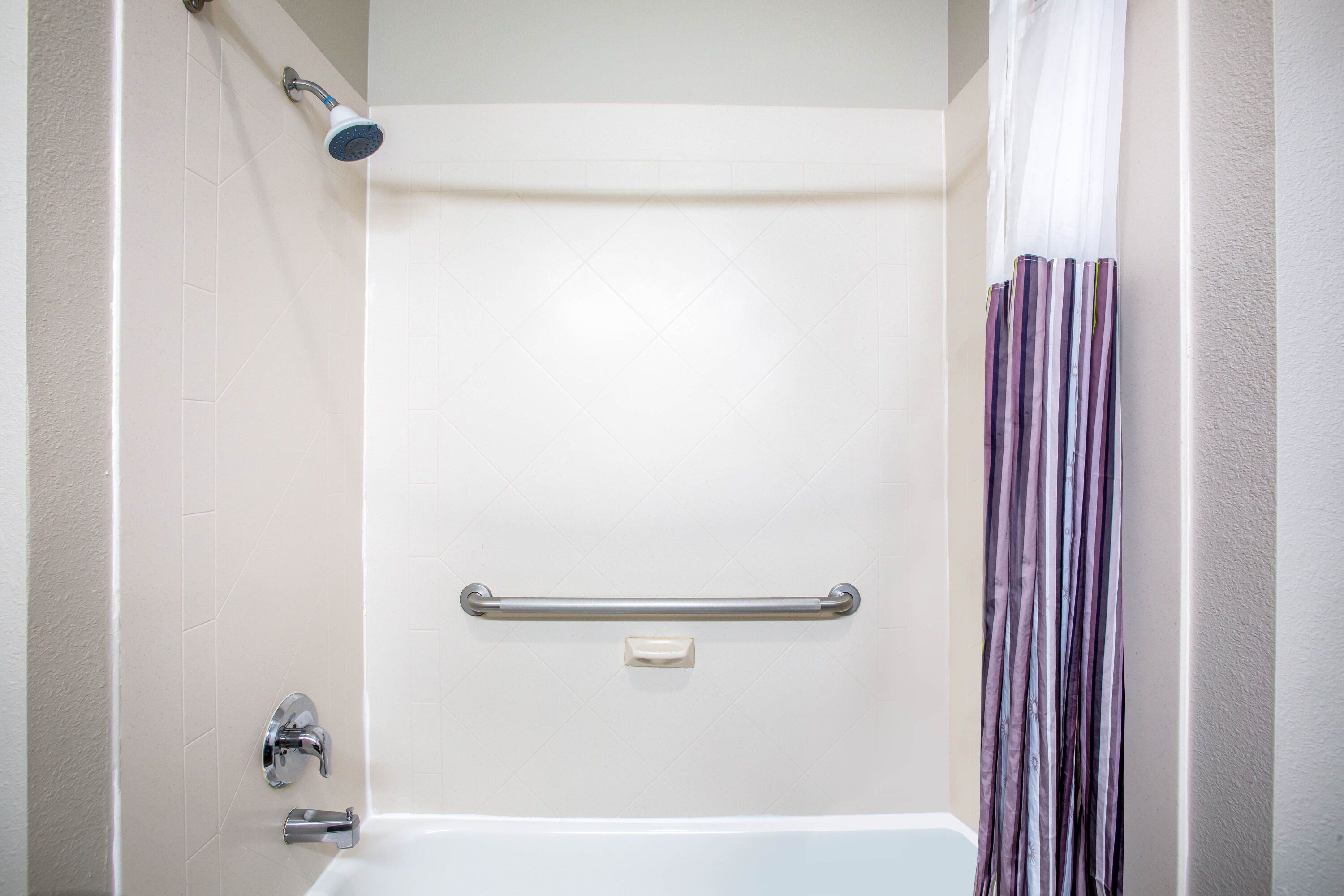 Guest room bath at the La Quinta Inn & Suites by Wyndham Columbus TX in Columbus, Texas