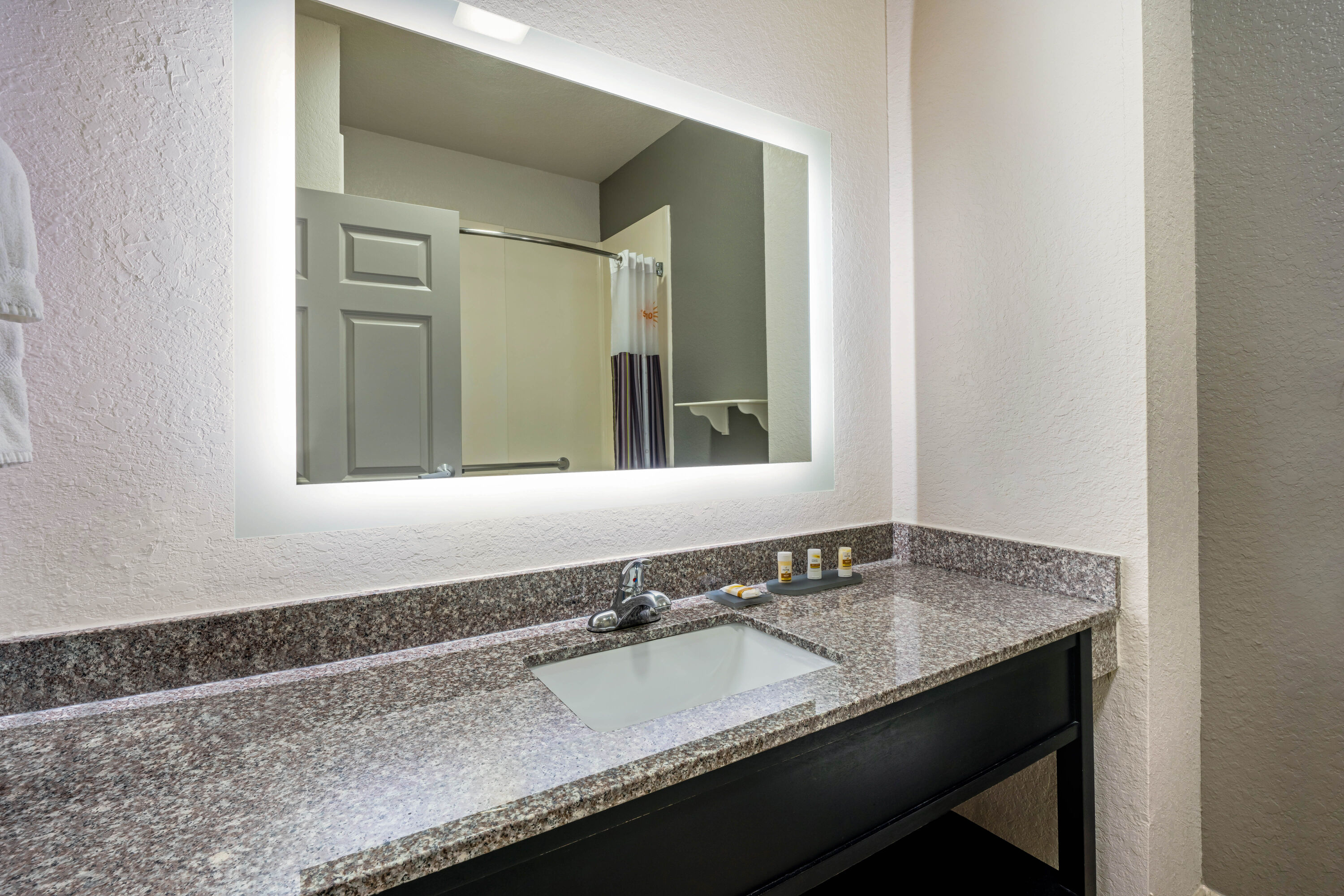 Guest room bath at the La Quinta Inn & Suites by Wyndham Conroe in Conroe, Texas