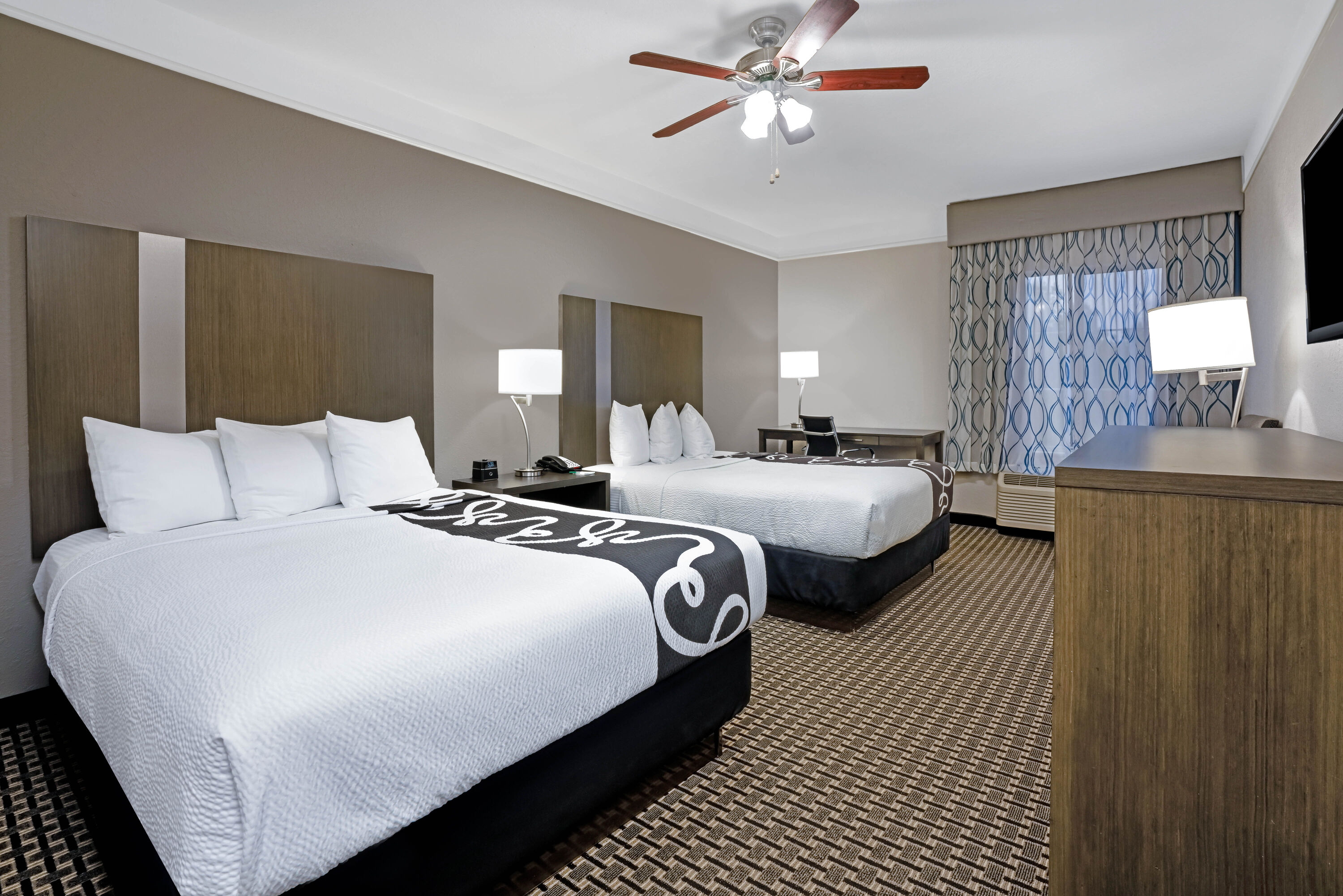Guest room at the La Quinta Inn & Suites by Wyndham Conroe in Conroe, Texas
